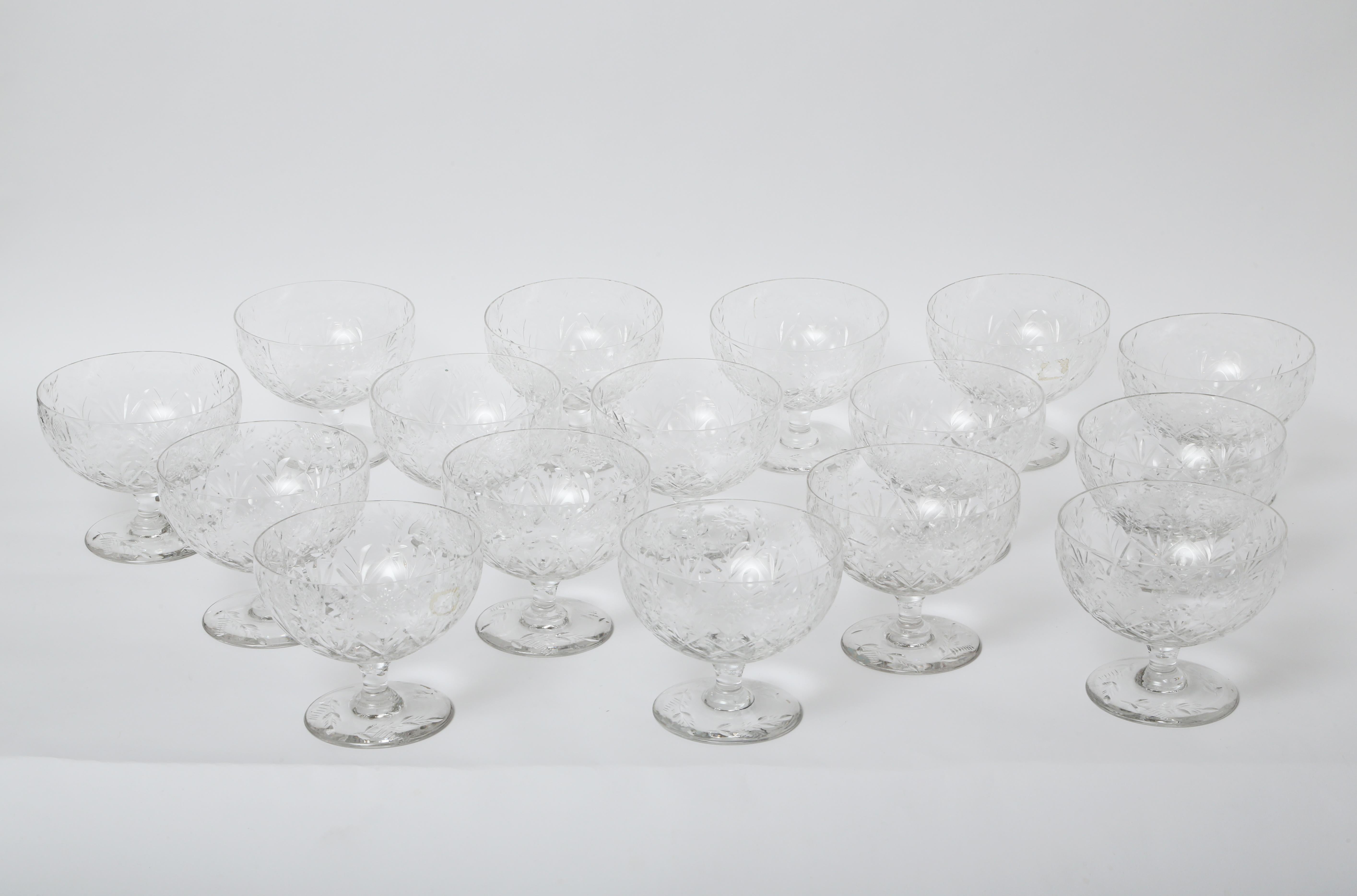 A great and practical set of nicely cut crystal coupes in a modified cross hatch design with a pedestal foot. A perfect size for desserts, ice cream, mousse and so much more. The elegant base on them enables them to sit up pretty on an underliner or