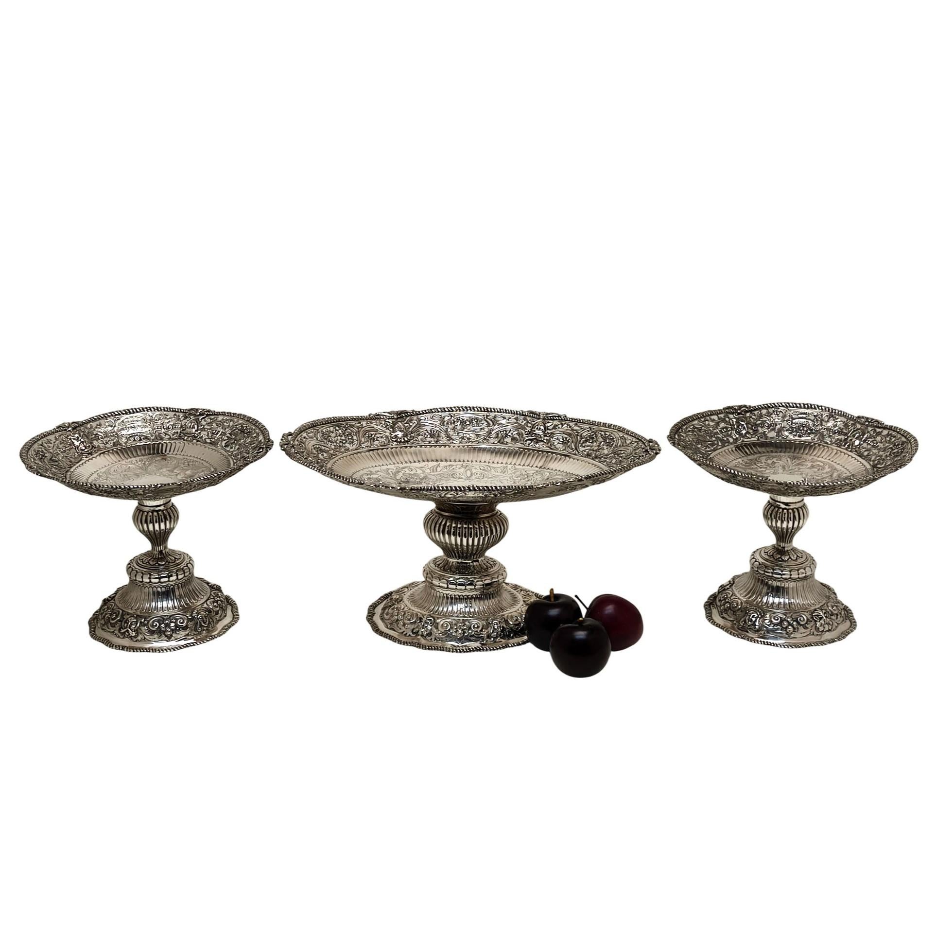 A magnificent Set of 3 Antique Victorian Sterling Silver Comports. This Suite of 3 Victorian Comports makes for an impressive table centrepiece but can also be uses individually. Each Silver Comport has an ornate chased and pierced border of scroll
