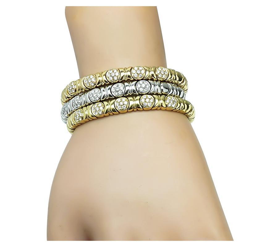 This is an amazing suite of 3 18k yellow, pink and white gold bangle set. The bangles are set with sparkling round cut diamonds that weigh approximately 3.00ct. The color of these diamonds is G with VS clarity. The bangles measure 7mm in width and