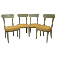 Suite of 4 Chairs in Painted and Gilded Wood, Leather Seat, Regency Style.