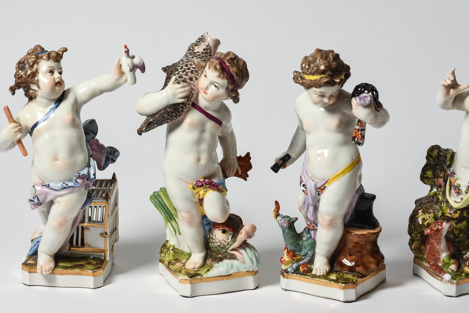 A delightful set of 4 fine porcelain sculptures created by the world re known firm of KPM, or The Royal Porcelain Factory of Berlin. Each piece has been very finely hand molded and sculpted and then meticulously and realistically hand painted. The
