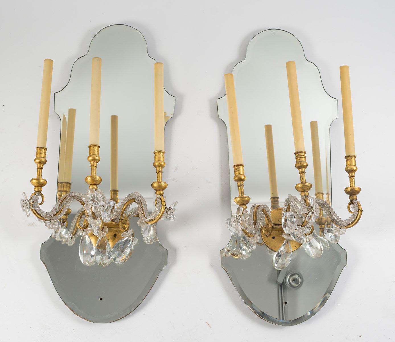 Suite of 4 gilded iron and mirror sconces with glass drops, 1950-1960.

Suite of 4 sconces from the Maison Delisle, 1950-1960, in mirror and gilded iron with glass pendants.  
h: 85cm, w: 33cm, d: 30cm
