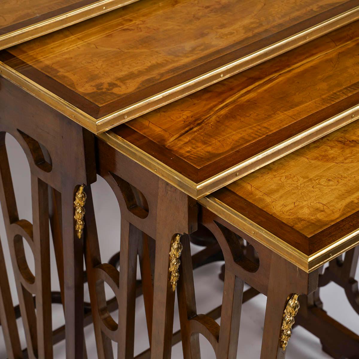 Suite of 4 nesting tables, 19th century, Napoleon III period.

Suite of 4 nesting tables with fine decoration on the glass-covered tops, chased and gilt bronze mounts, 19th century, Napoleon III period.
3 retractable and 1 separate
The largest: H: