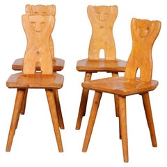 Suite de 4 chaises en bois à dossier zoomorphe, années 1960