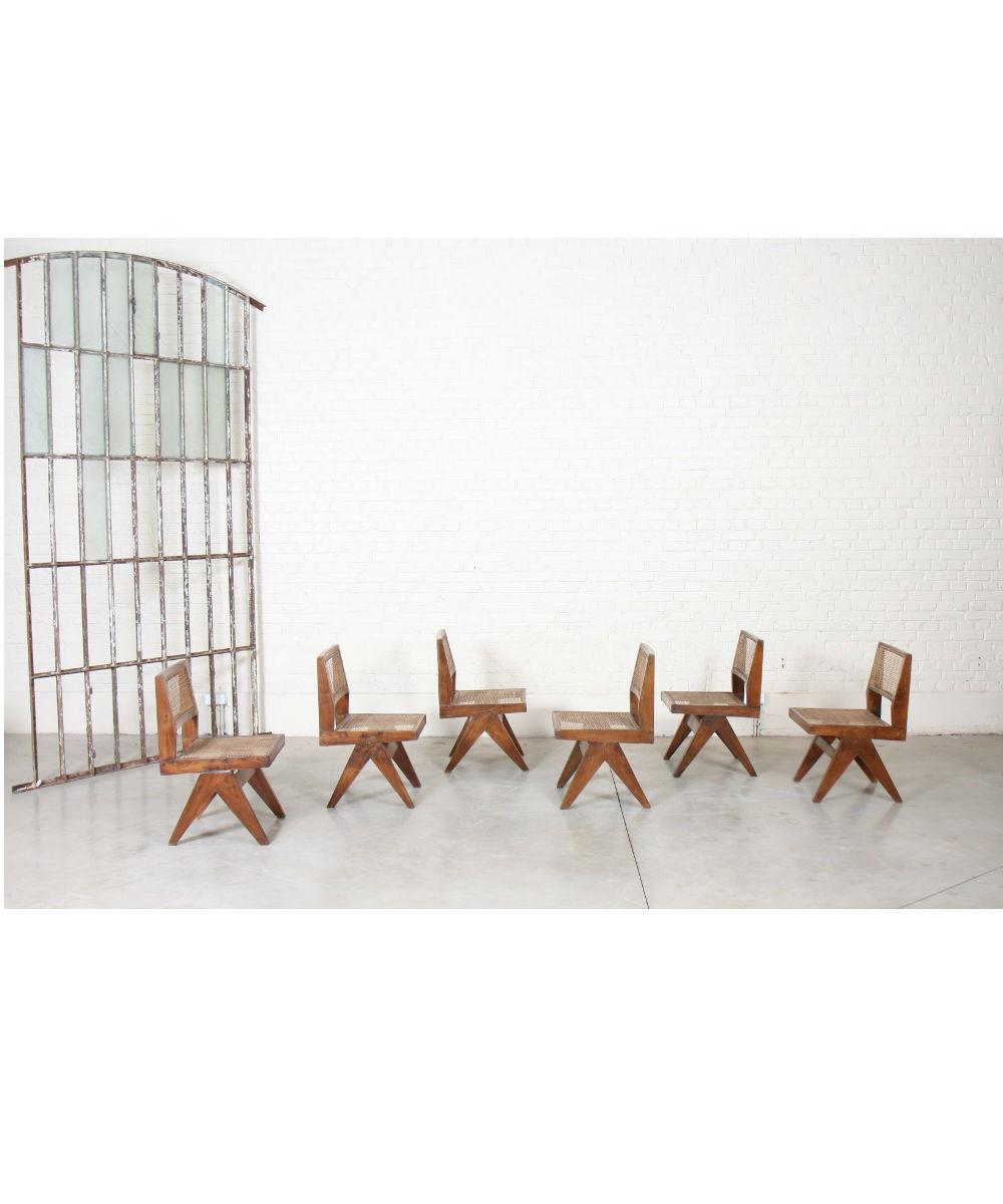 Solid teak chairs with double side legs of compass type joined by two spacers. Backrest and seat with cane bottom,
circa 1958-1959.

Restoration of use and maintenance.
Provenance: University of Chandigarh, India.
Dimensions: Height 83; Width