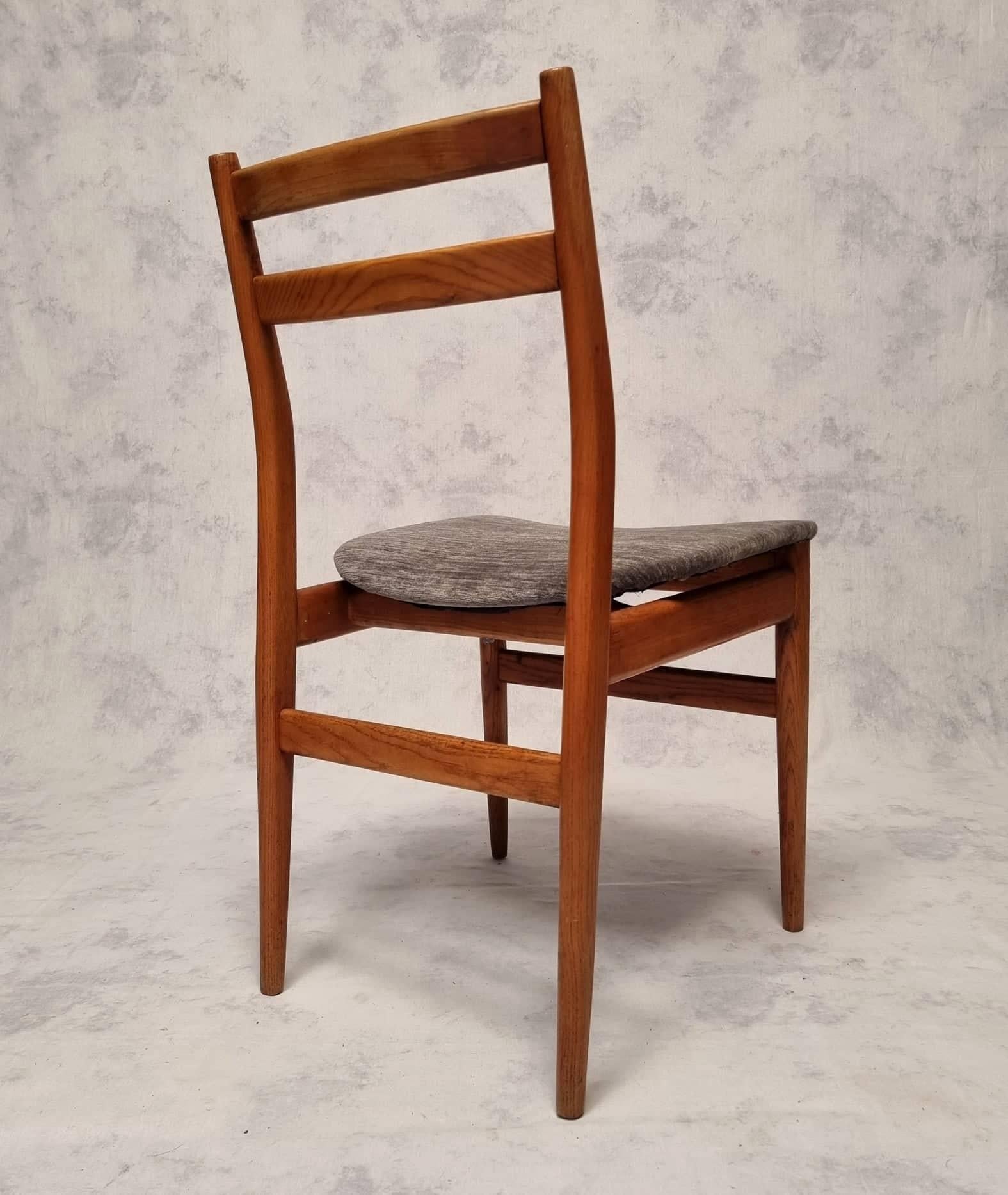 Set of six vintage French chairs from the 1960s. Structure in elm with a very pretty honey patina. Each chair has a unique grain. The uprights are rounded and two flat crossbars with equally rounded finishes form the backrest. This backrest is