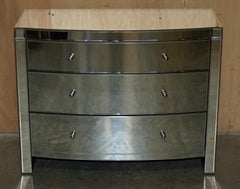 SUITE OF BOW FRONTED MIRRORED GLASS CHEST OF DRAWERS WiTH PAIR OF SIDE TABLES