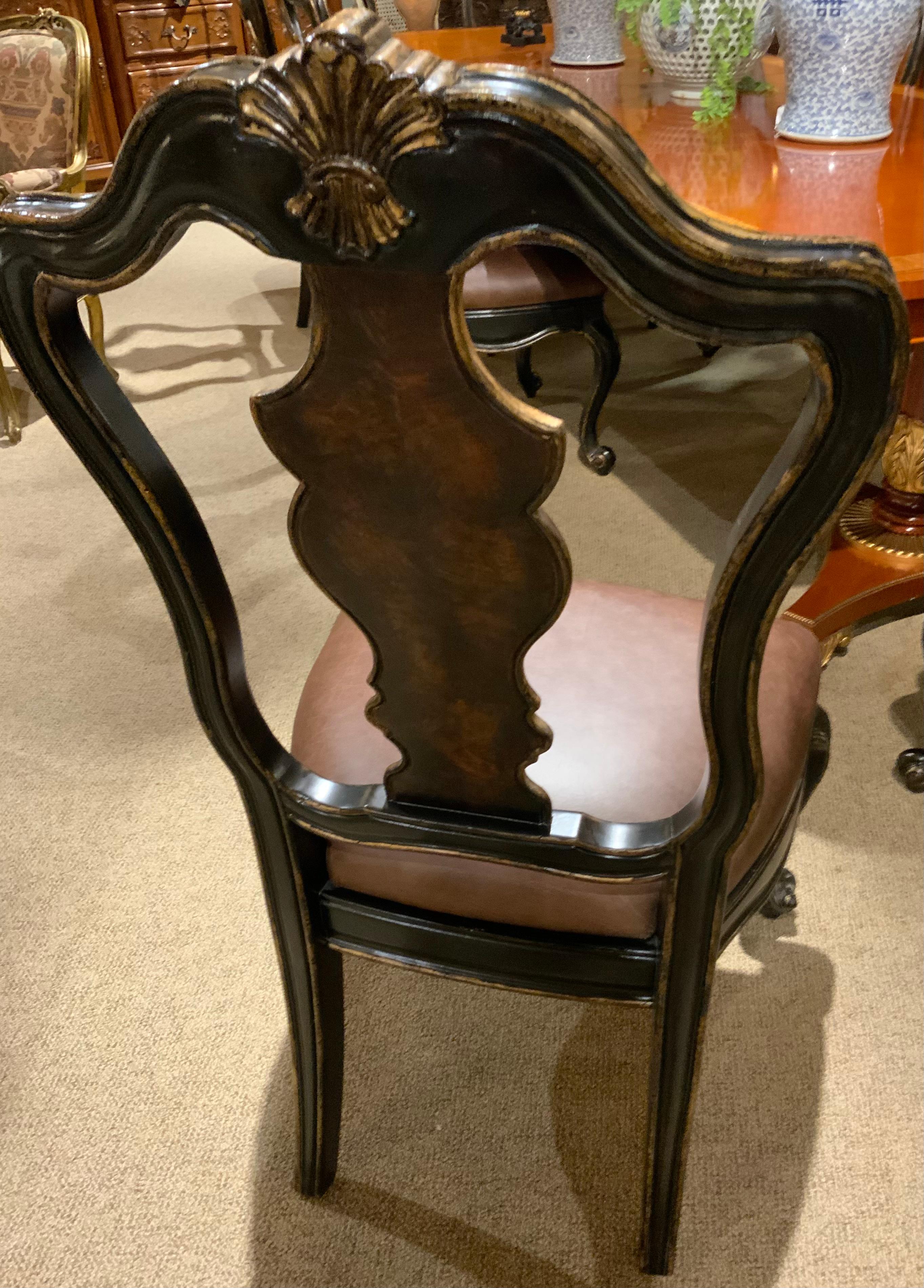 The seats are generous in size and very comfortable.
The burl wood has a fine patina. The ebonized finish 
Has applied gilt accents. The front legs are fashioned
In a Louis XV-Style cabriole leg that ends in a curl. The
Crest of the chairs have a
