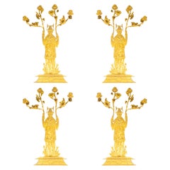 Suite aus vier vergoldeten Bronze-Wandleuchtern, um 1920, Chinoisant-Stil.