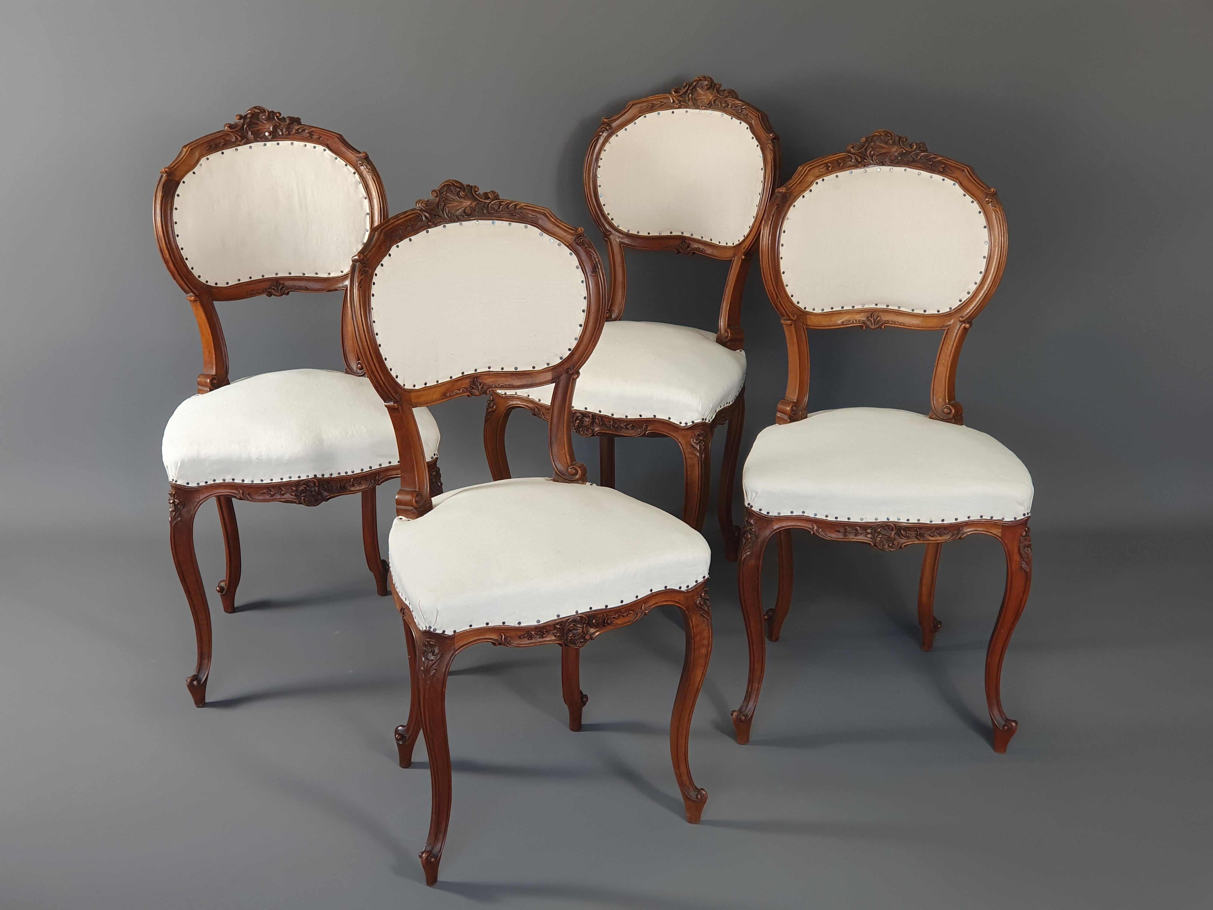 Walnut Suite of Four Louis XV Rocaille Chairs