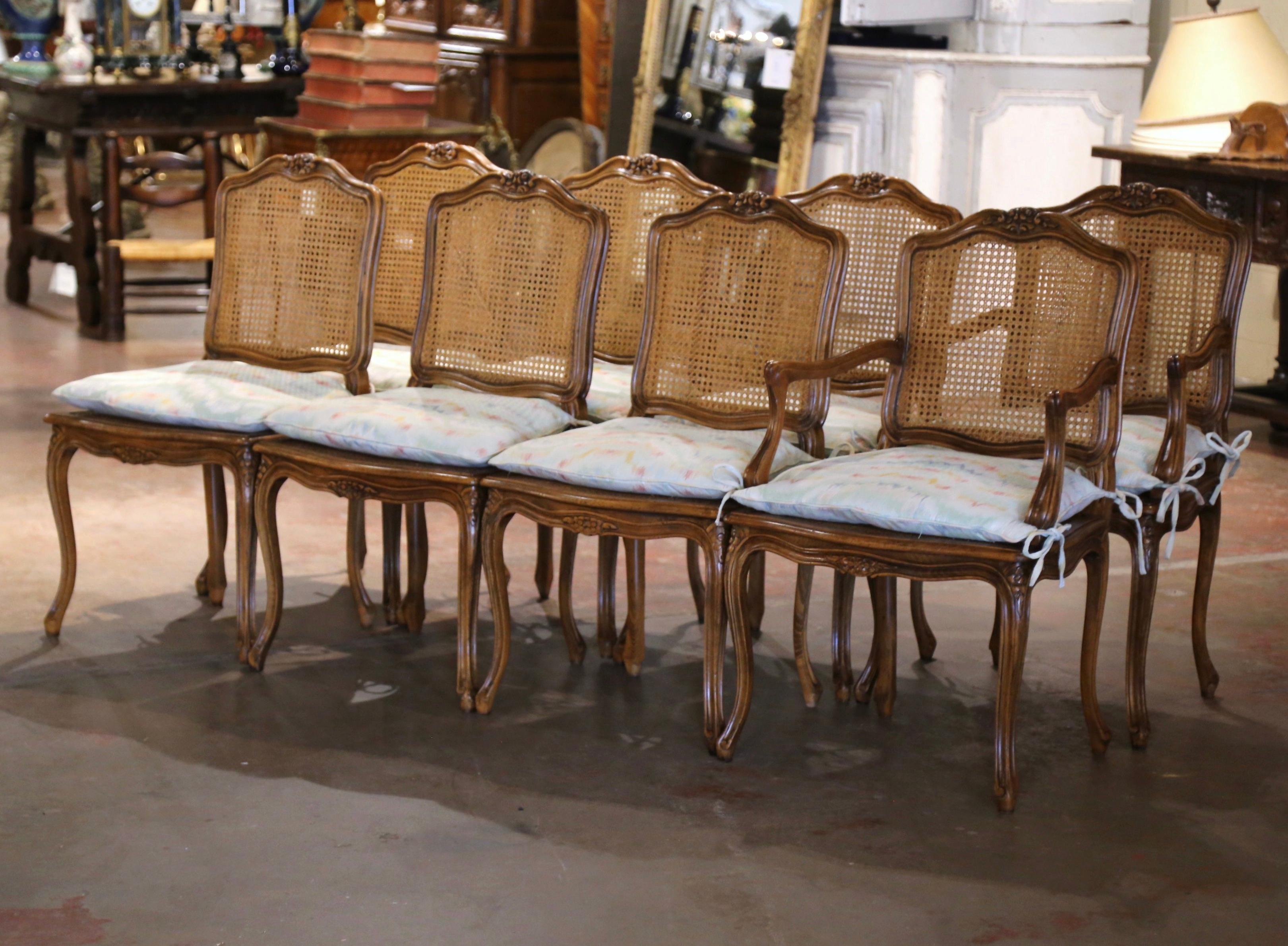 Decorate a dining table with this elegant suite of antique side chairs and matching armchairs. Crafted in France circa 1980, each chair stands on cabriole legs ending with scrolled feet, and decorated with floral motifs at the shoulders, over a