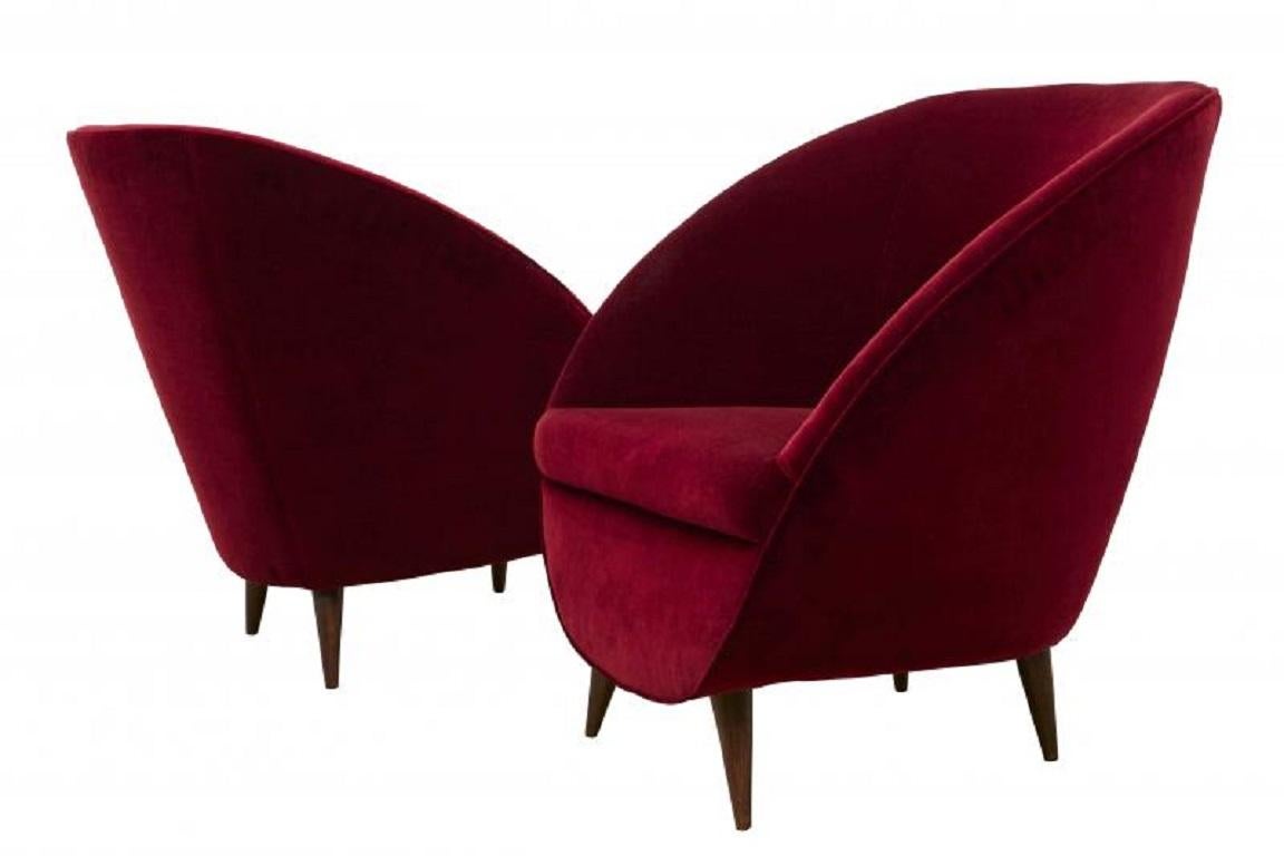 Late 1950's to 1960's Milanese Style sofa. There is a matching pair of chairs with foot stools, and a small oval marble topped table listed independently. These pieces are completely rebuilt and reupholstered in Rigoletto Cotton Velvet by Kerry