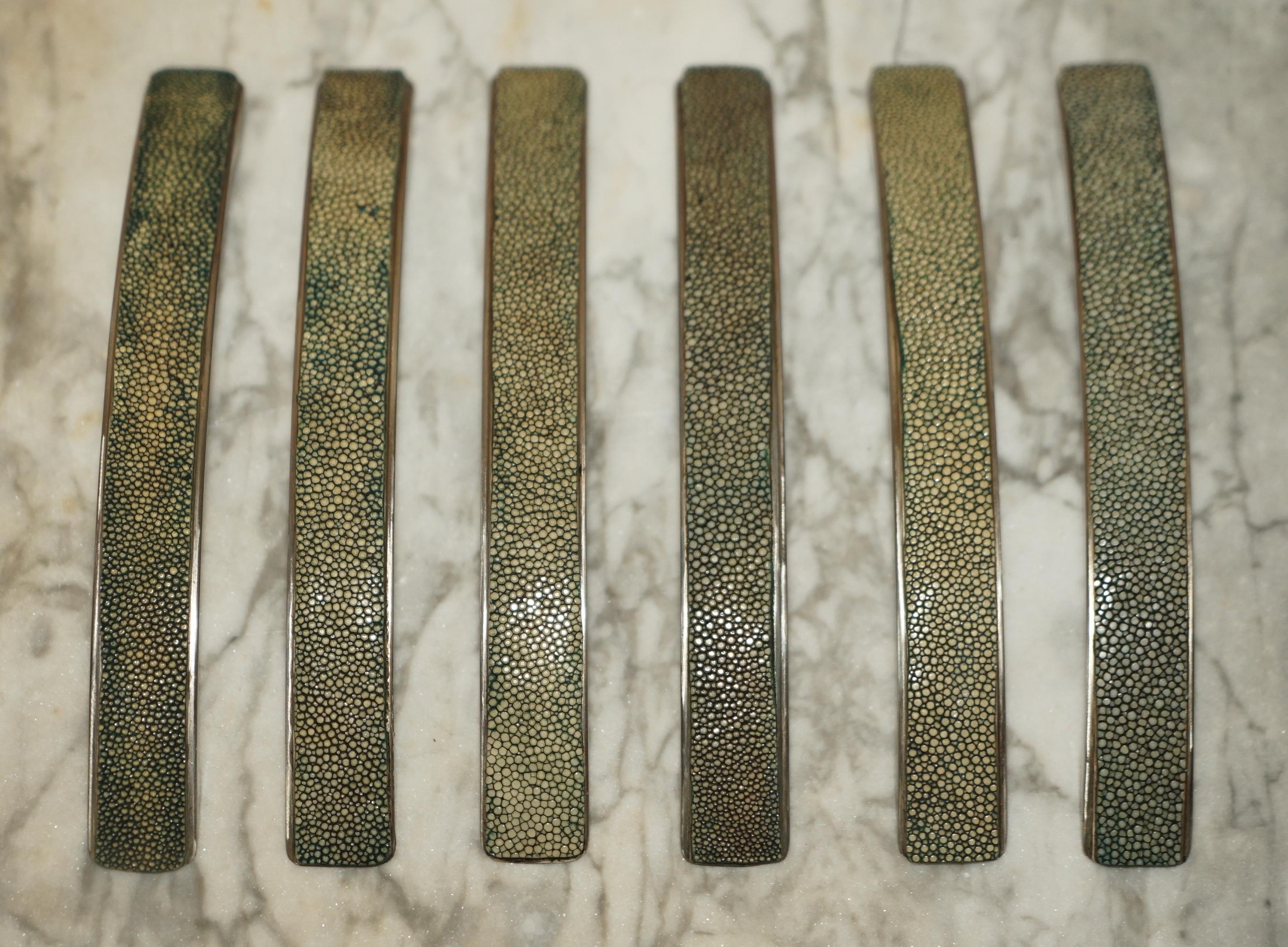 We are delighted to offer for sale this very rare suite of six Shagreen upholstered drawer handles.

Shagreen is super collectable, it is basically manta ray or shark skin.

I bought these with a view to using them on a project but I have gone