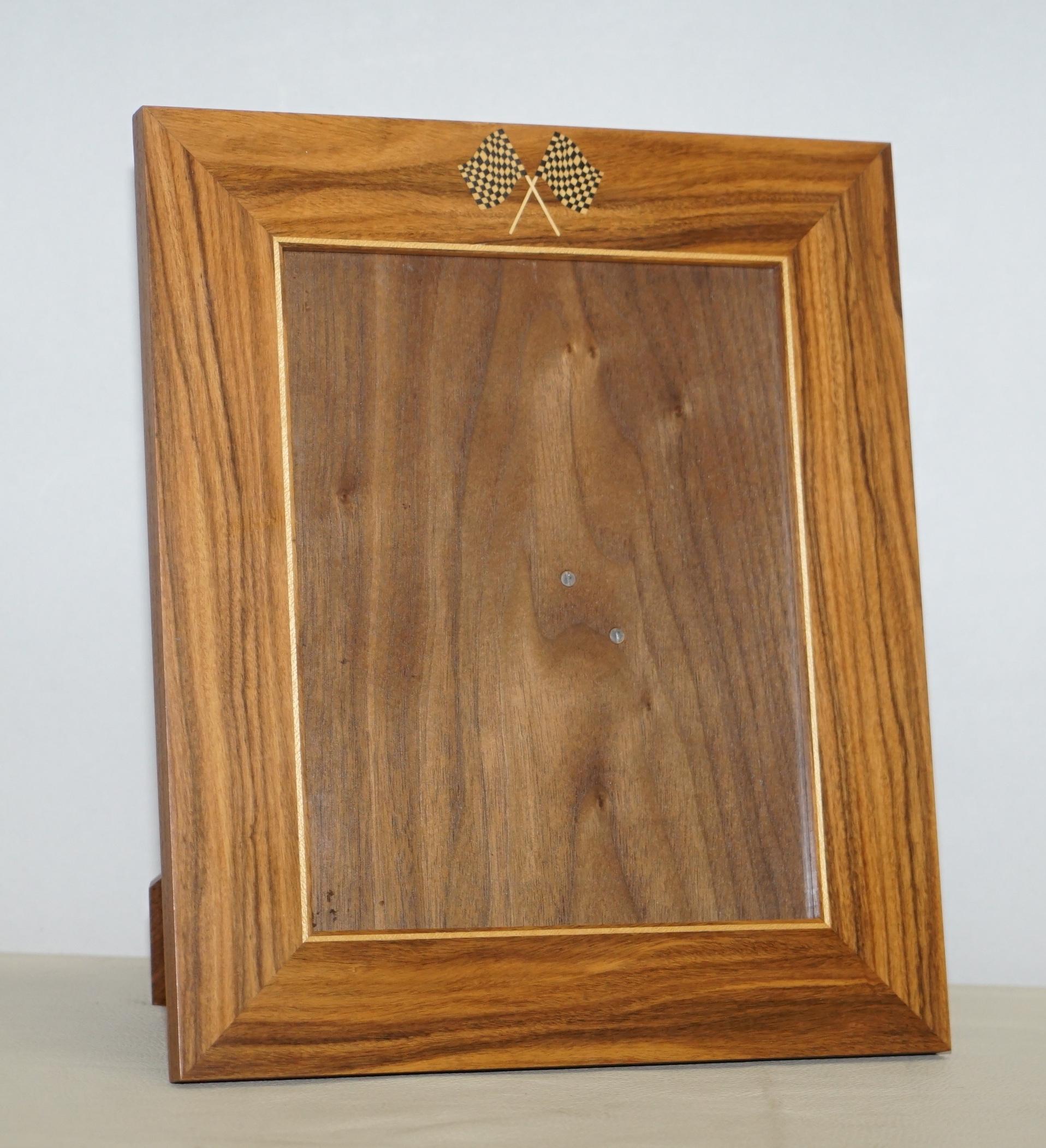 We are delighted to offer for sale this custom made to order suite of three Viscount David Linley walnut picture frames with racing car checker flags to the top

A very rare and highly collectable suite of three luxury frames, I’ve never seen