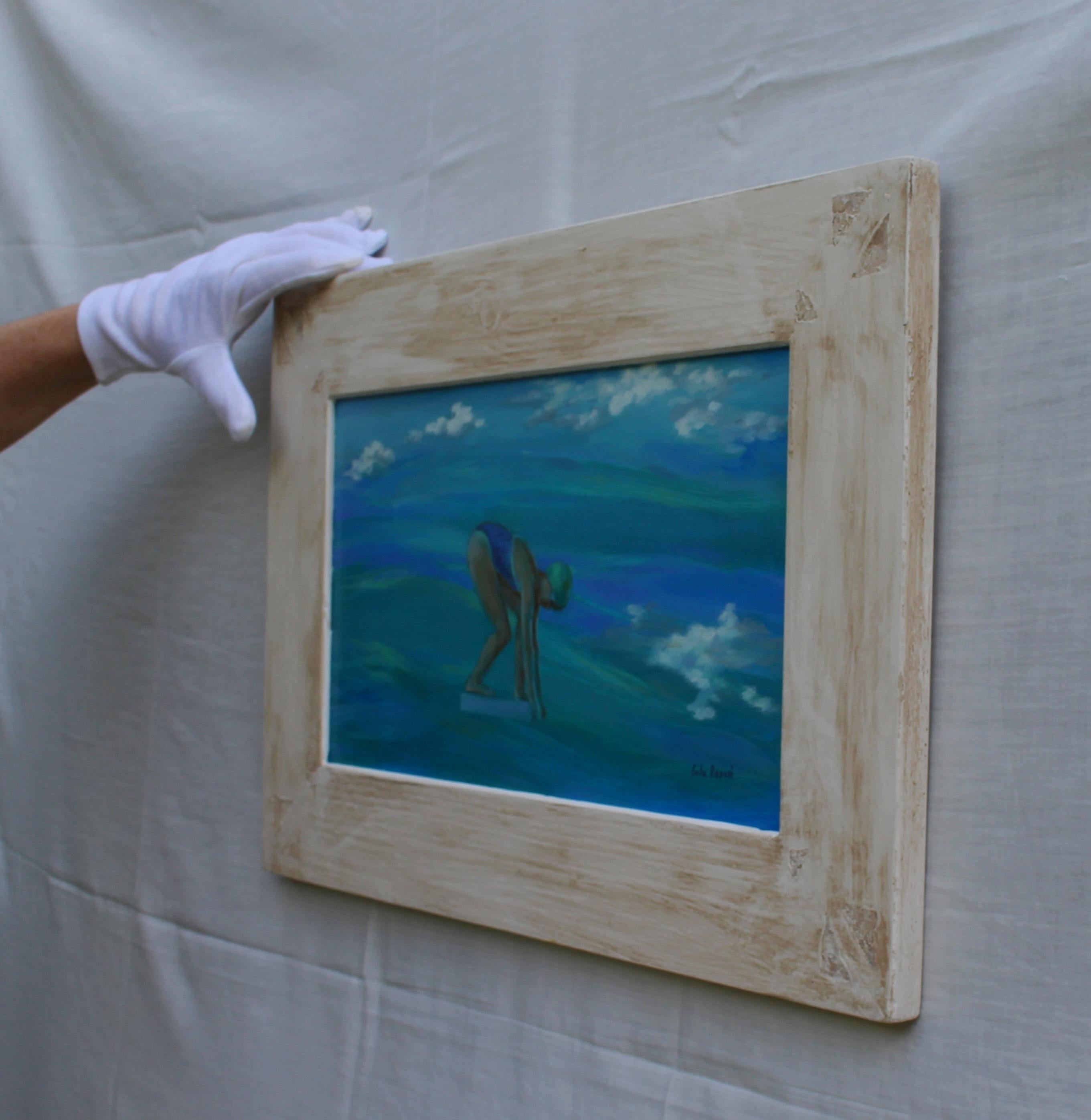 Peinture à l'huile figurative sur panneau de bois intitulée Just Before, représentant une nageuse prête à plonger dans une mer bleue, encadrée dans du bois fait à la main.

Cette peinture figurative à l'huile sur bois, intitulée Juste avant, capture