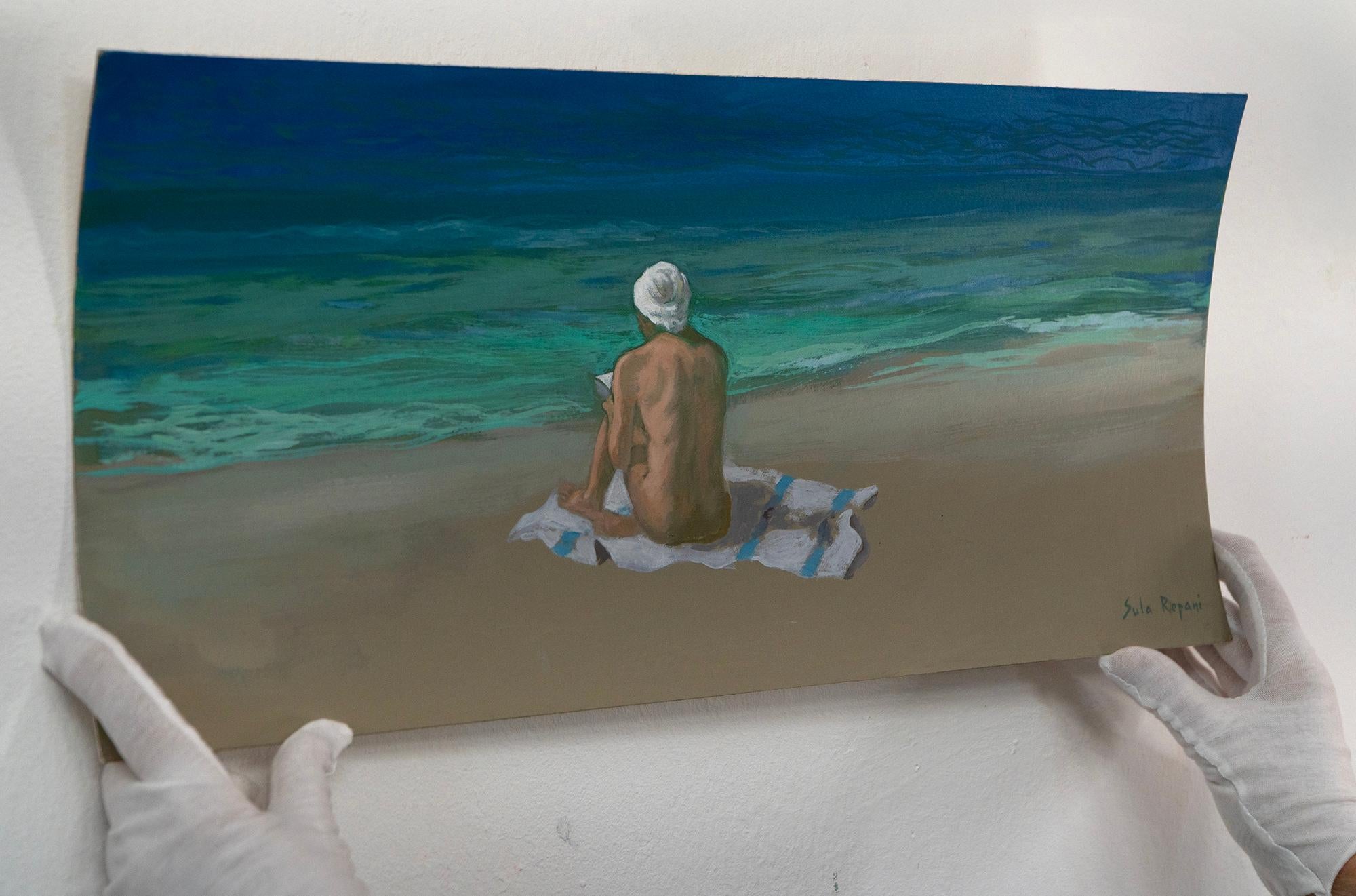 Escena de playa figurativa contemporánea pintada al óleo sobre cartón, titulada Turbante blanco, que muestra un momento sereno de nudismo junto al mar, con marco de madera hecho a mano.

Esta pintura figurativa contemplativa al óleo sobre cartón