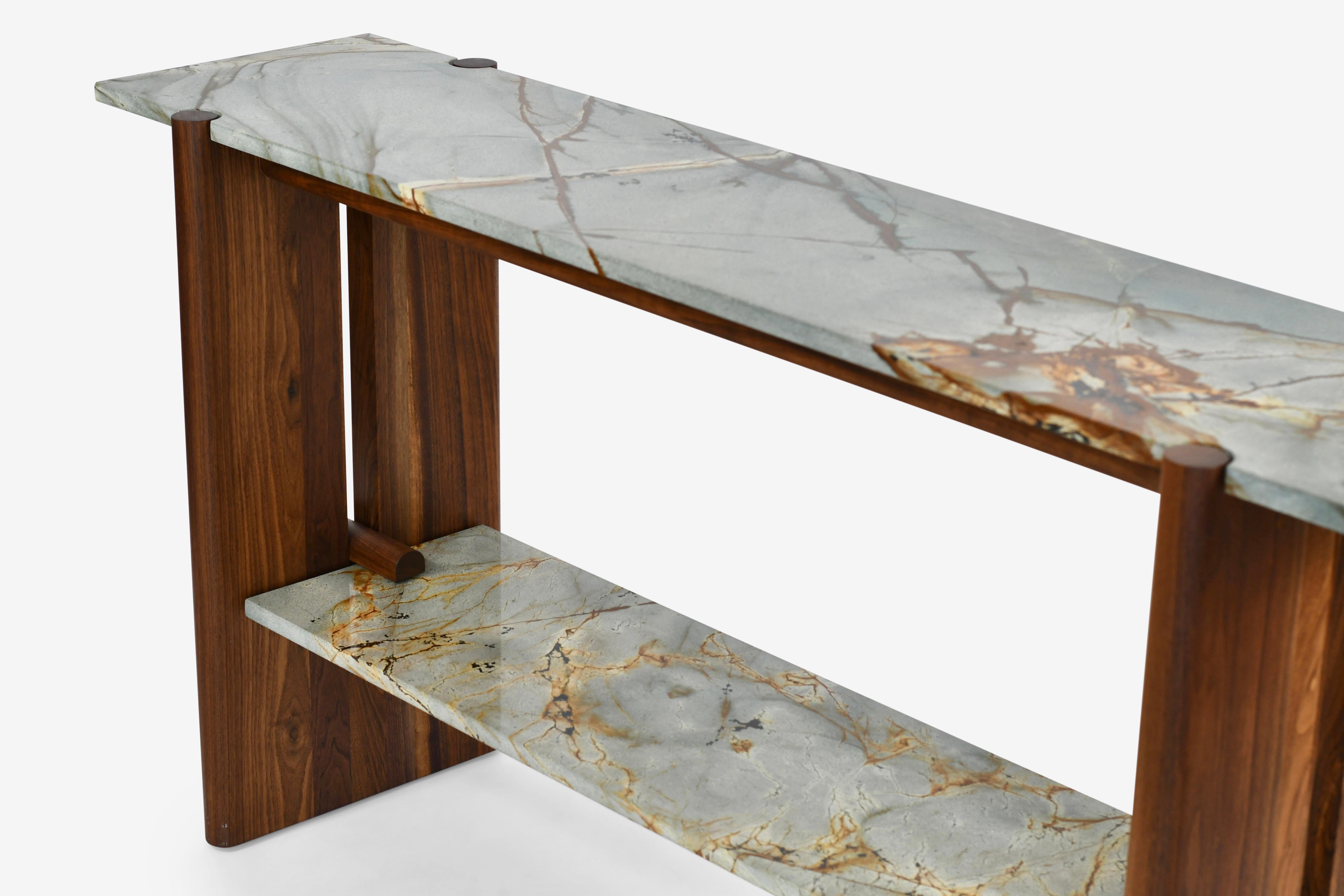 The Sulaco Console is defined by the interplay between shape and texture; the smooth rounded framework both compliment and contrast the Blue Mare Quartzite. The lower shelf is fully removable providing an extra layer of versatility and