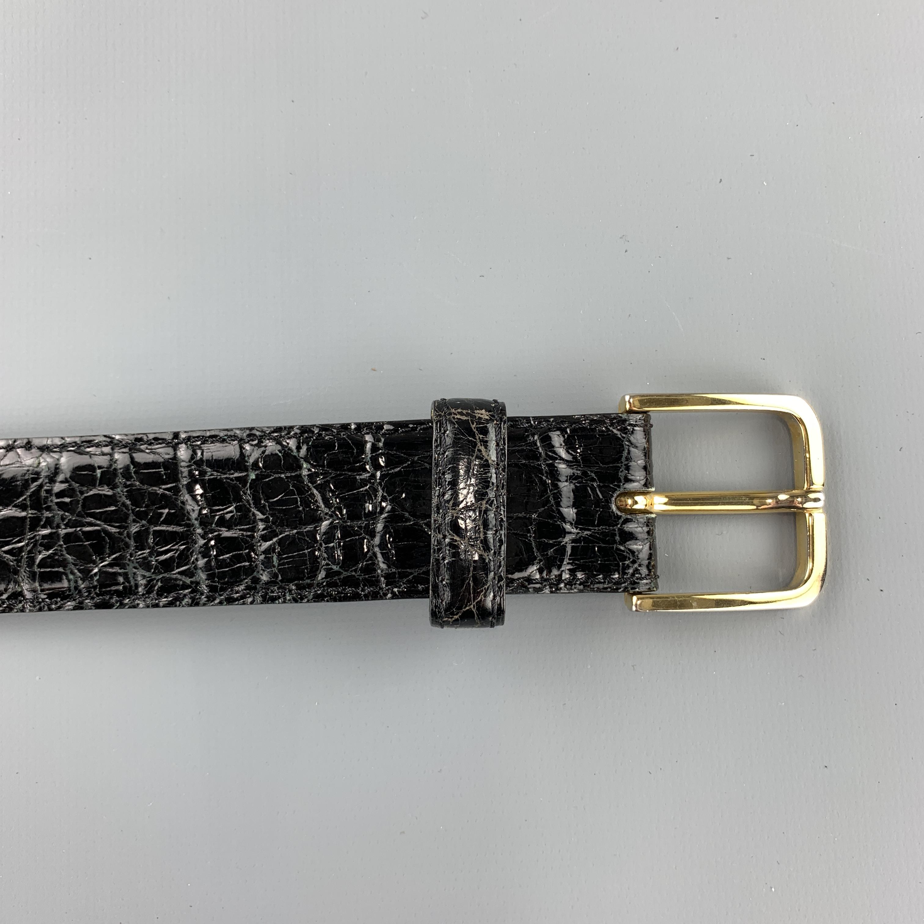 SULKA dress belt features a genuine crocodile leather strap with a gold tone snap off buckle. Made in Italy.

Very Good Pre-Owned Condition.
Marked: 95 / 36

Length: 44 in.
Width: 3 cm.
Minimum Fit: 36 in.
Maximum Fit: 40 in.
