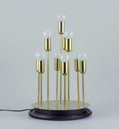 Sülken Leuchten, Germany. Modernist lamp for ten bulbs. Brass on wooden base