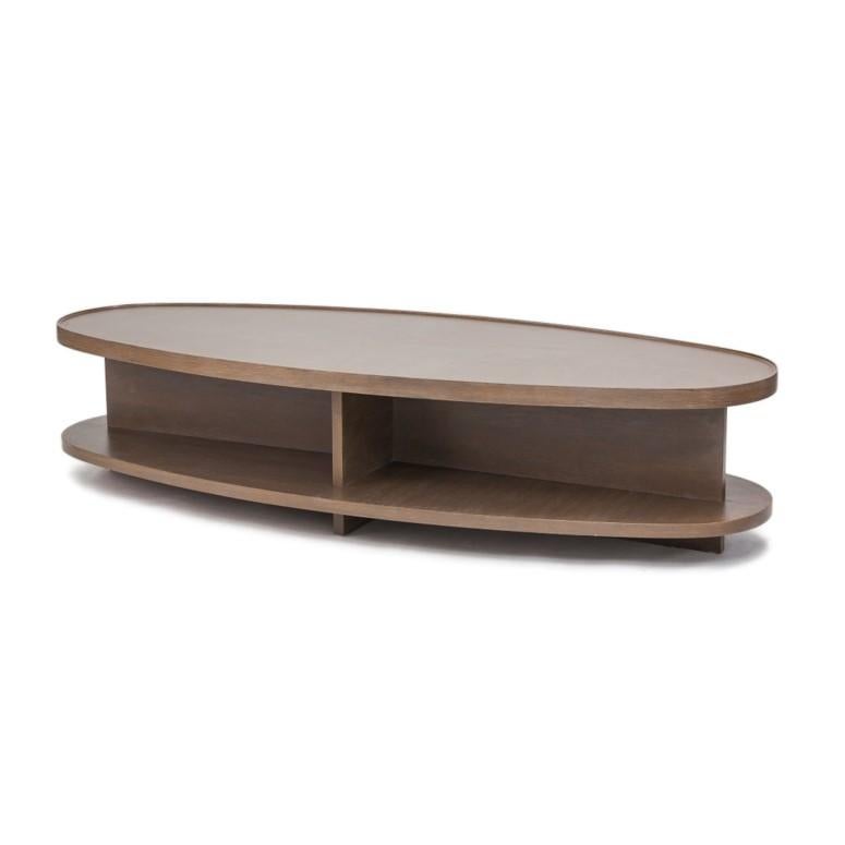 Oval shaped coffee table with lower shelf for additional display and storage space. Tabletop features stylized, raised edge detail. The Sullivan oval coffee table frame is constructed from maple wood applied with oak wood veneer. Four standard