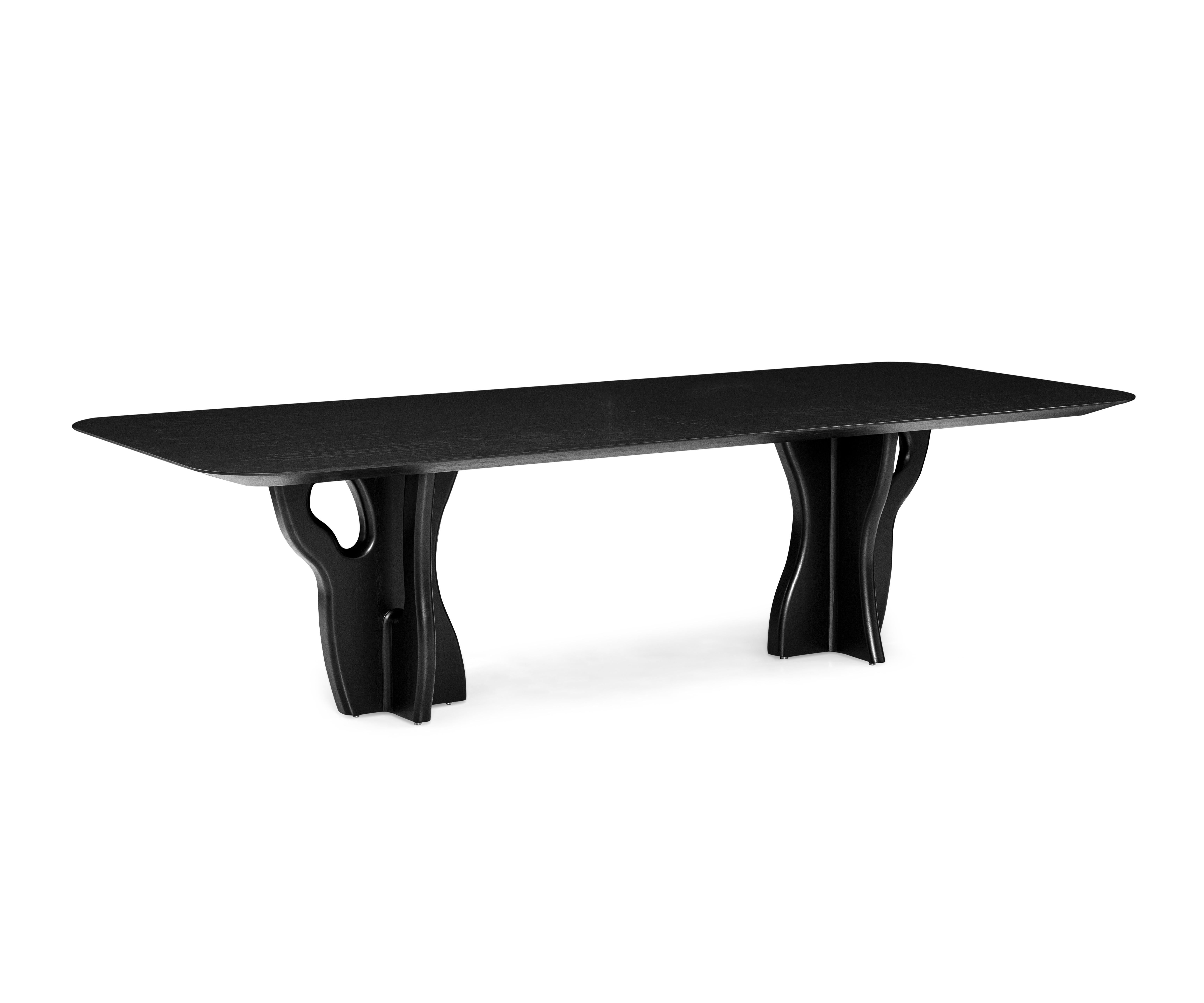 Uultis design team has manufactured the Suma dining table in a black oak finish top with organic solid wood legs, perfect for your dreamed dining space. This is a piece that is designed to be used during meals and gatherings, and it is also designed