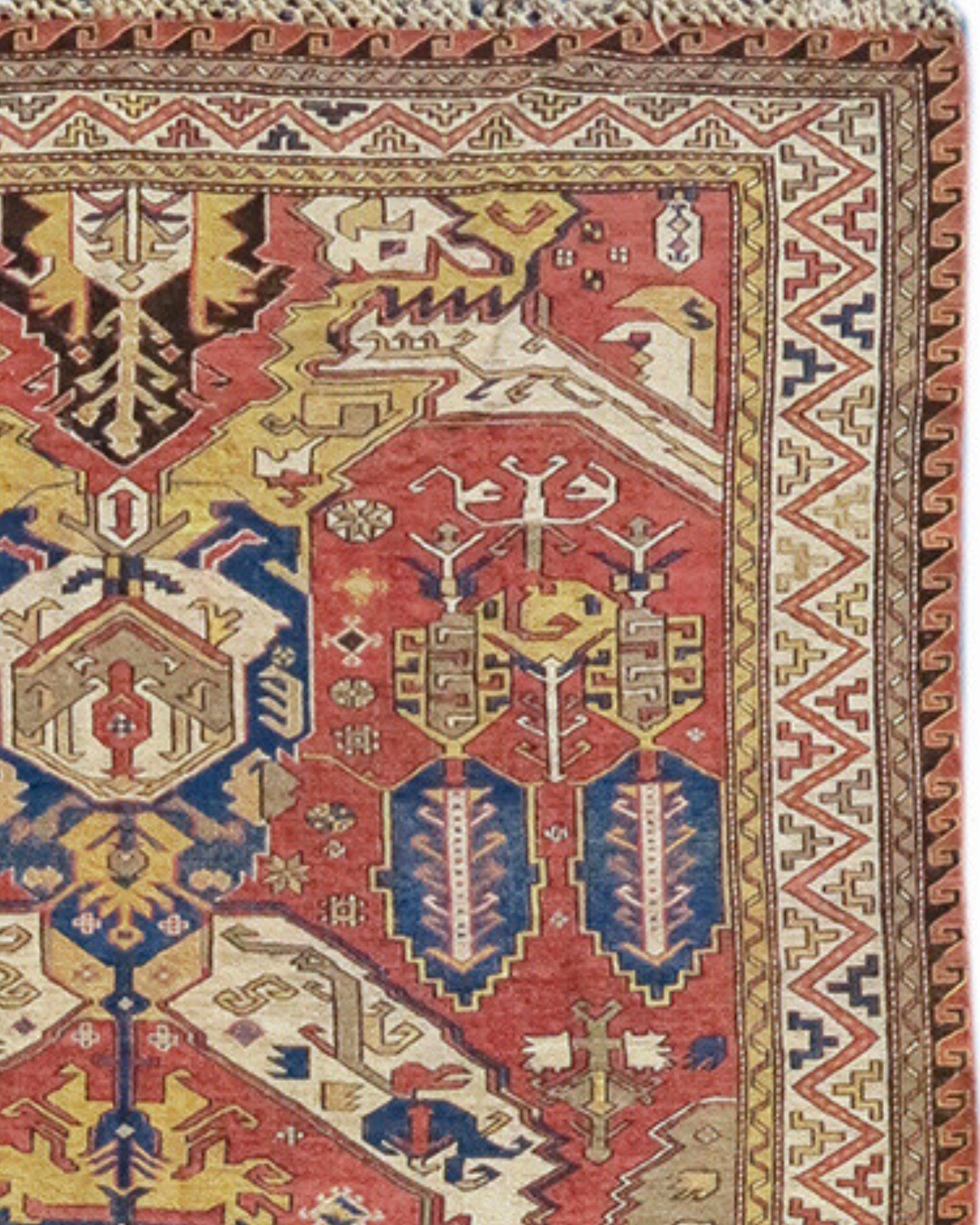 Antique Dragon Sumak Rug, Late 19th Century

Using the flat-woven sumac technique, this Caucasian carpet draws a design derived from the ‘dragon carpets’ of the 17th century. Highly stylized palmettes form a vertical column through the center of the