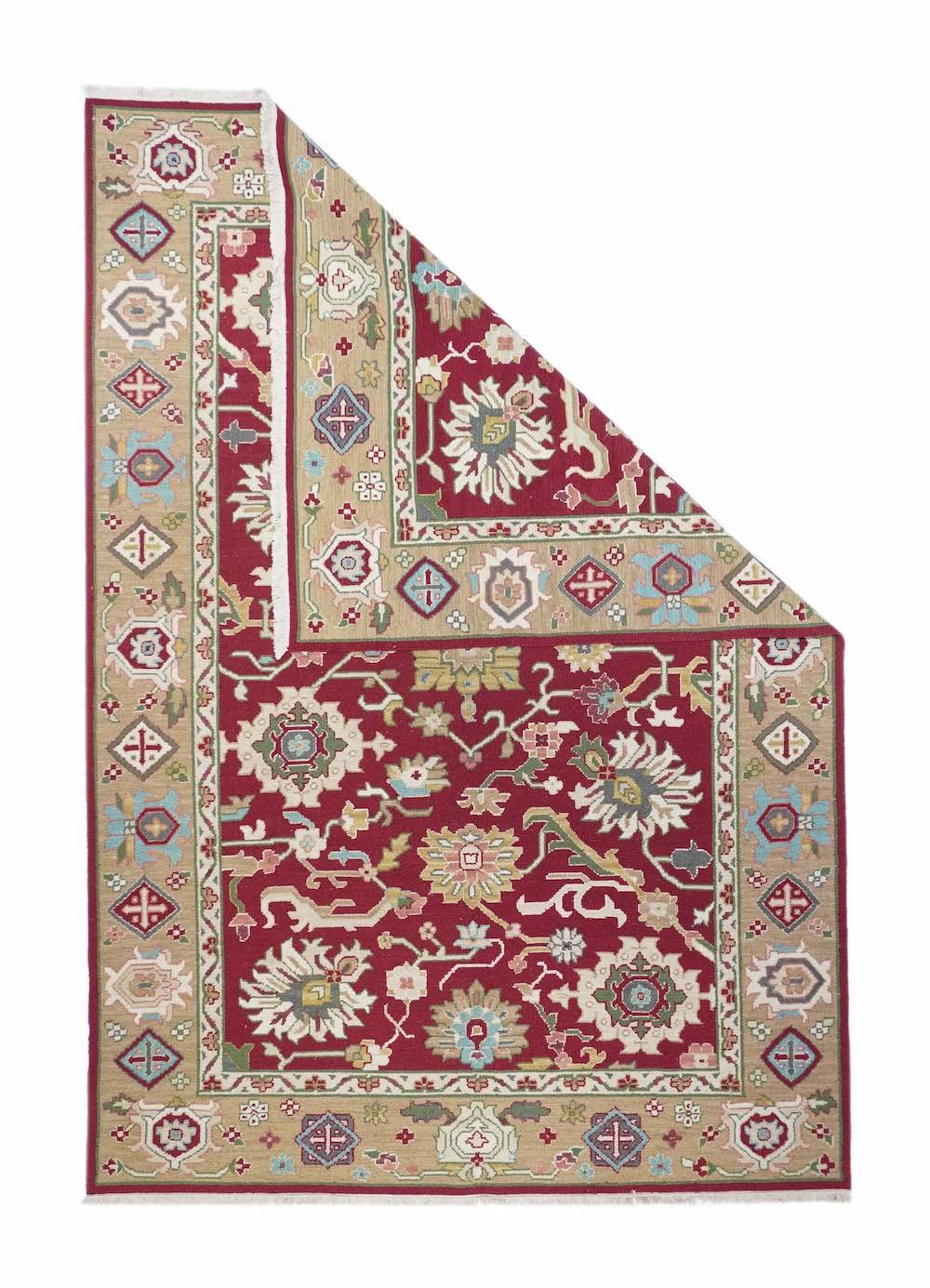 Sumak Rug 6'0'' x 9'0''. This modern Turkish Sumak shows a near black field centred by a rectangular, straw rosette, with ragged palmettes above and below, and large petal palmettes and torn rosettes up the sides. Strip-style main rose border with
