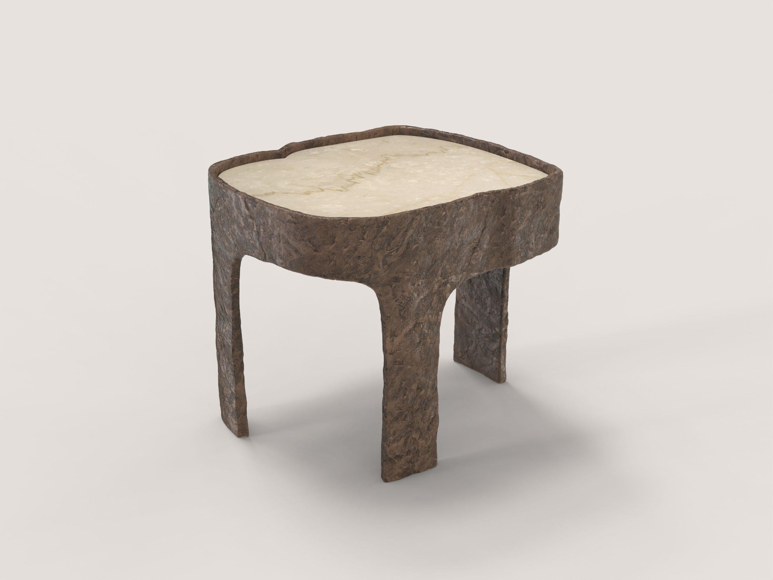Sumatra Bronze V1 Side Table by Edizione Limitata
Limited Edition of 15 + 3 pieces. Signed and numbered.
Dimensions: D 38 x W 44 x H 37 cm.
Materials: Cast bronze and botticino marble.

Sumatra is a 21st Century collection of tables made by