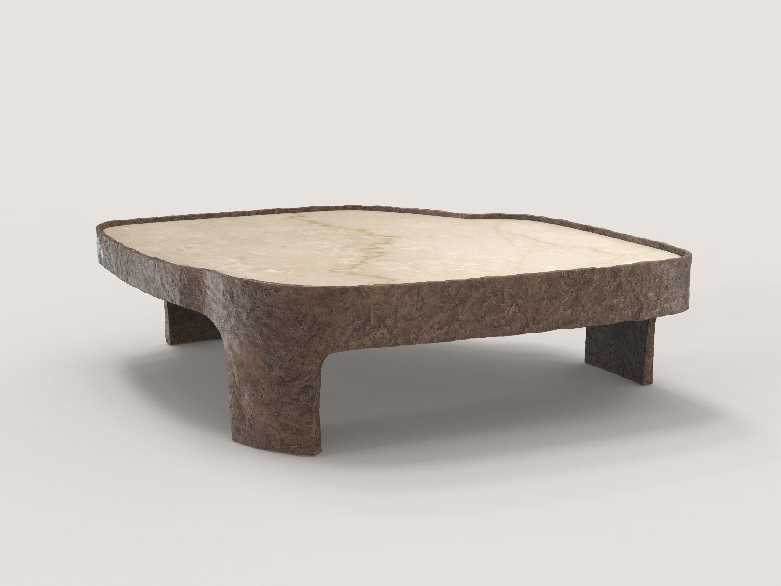 Sumatra bronze V2 low table by Edizione Limitata
Limited Edition of 15 + 3 pieces. Signed and numbered.
Dimensions: D 100 x W 100 x H 30 cm.
Materials: Cast bronze and botticino marble.

Sumatra is a 21st Century collection of tables made by