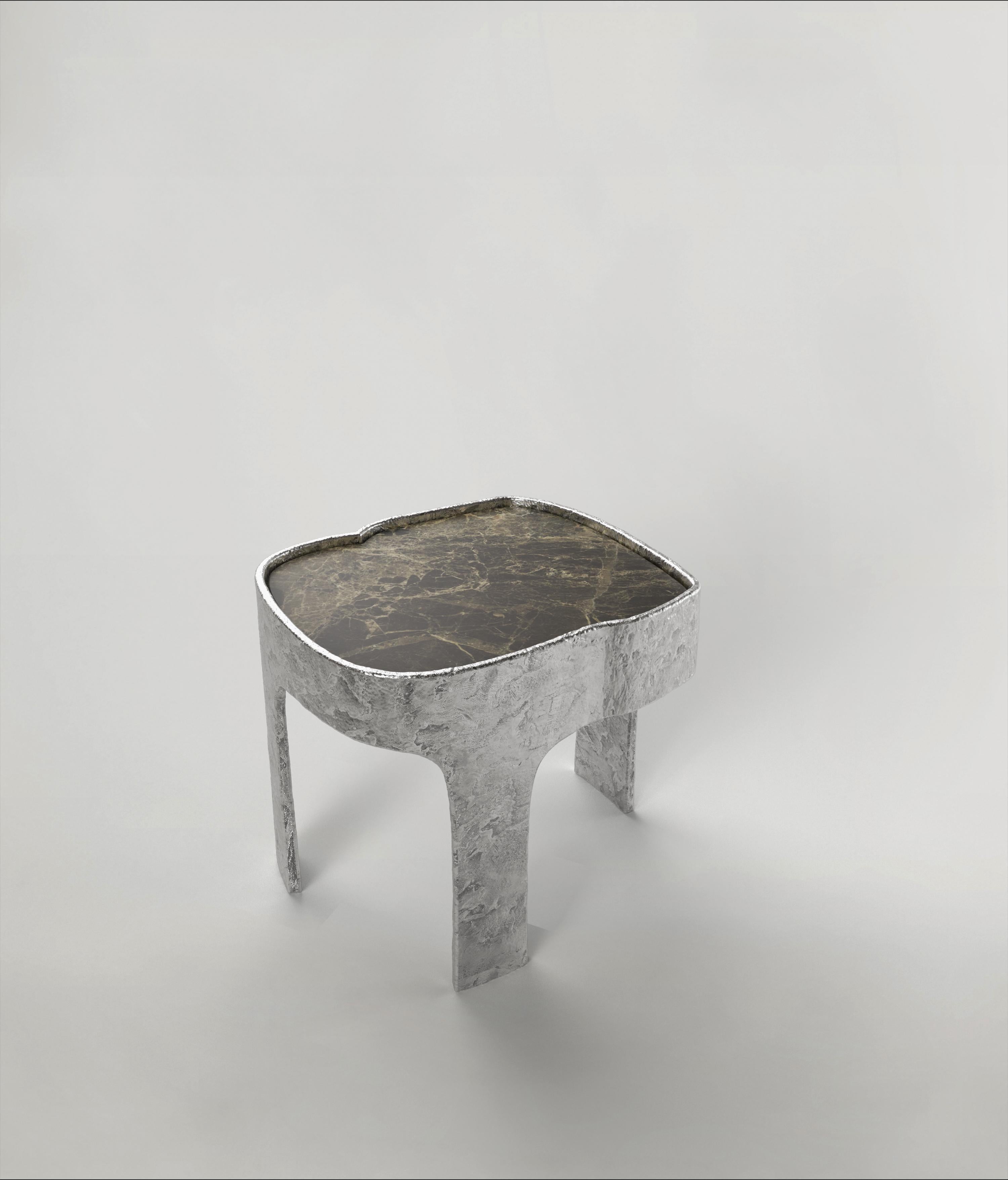 Sumatra V1 Side Table by Edizione Limitata
Limited Edition of 15 + 3 pieces. Signed and numbered.
Dimensions: D44x W38 x H37 cm
Materials: Aluminum + Breccia Paradiso Marble

Sumatra is a 21st Century collection of tables made by Italian artisans in