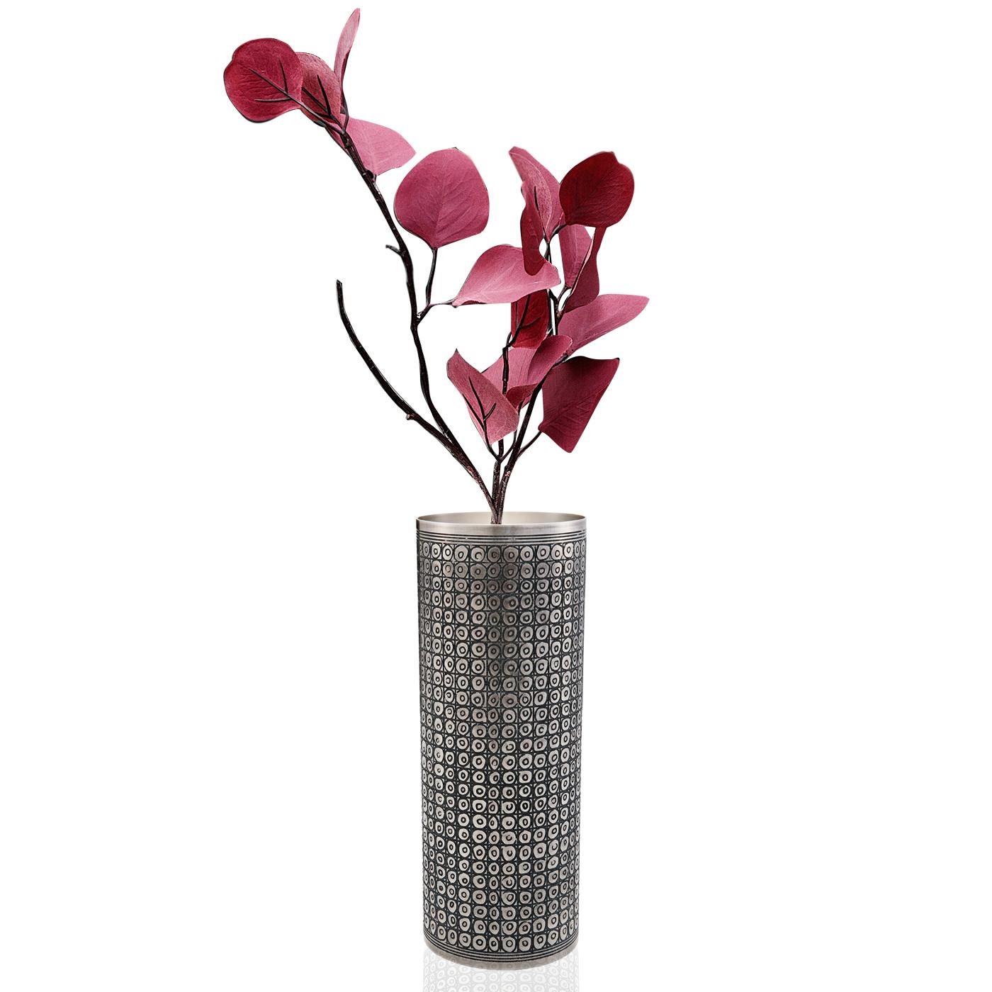Unique vase crafted in a silver plated alloy has a beautiful pattern etched into it which is the product of much meticulous work in order to achieve the intricate texture and design.