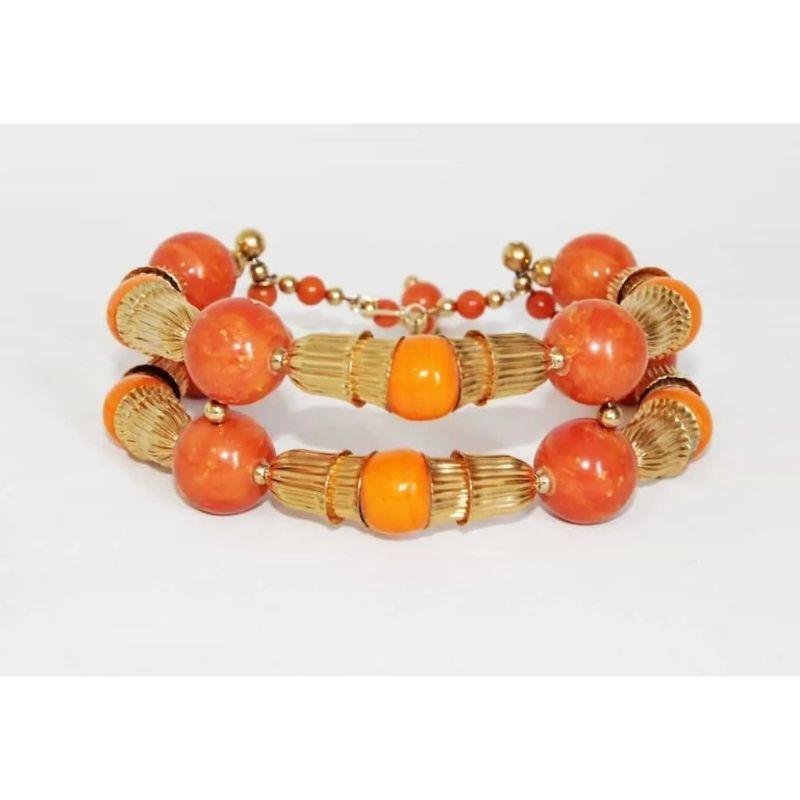 Gorgeous summer Kenneth Jay Lane vintage necklace of the 70s. Made of resin orange and coral beads and gilt metal.  

Marked : Kenneth Lane
Size : 42  x 5  cm – 16.5  x 2  in. 
Condition: Excellent vintage condition 
