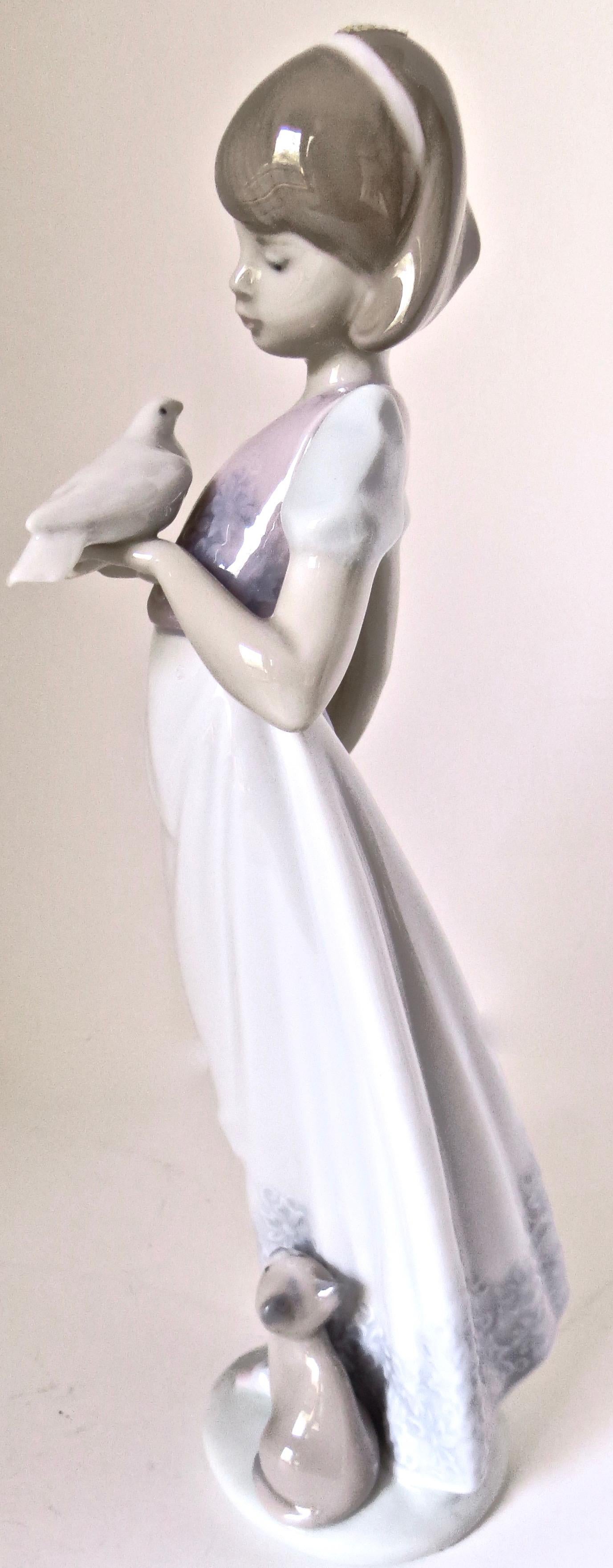 This was a limited edition hand painted porcelain made and retired in 1991 by Lladro in Spain. Designed and sculpted by world renowned artist, Juan Huerta, it is entitled 