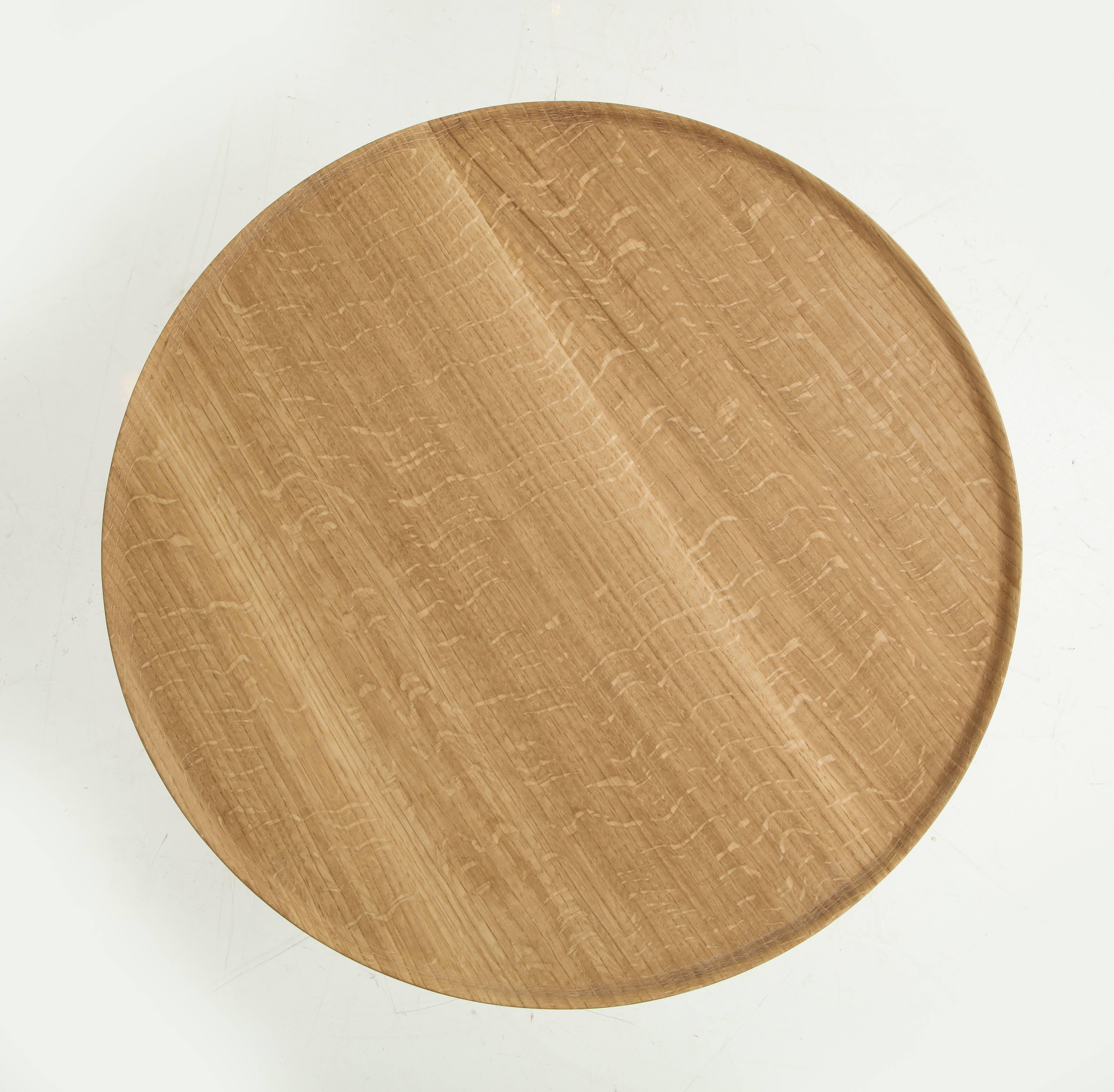 Graciously designed solid wood tray tables in three different sizes and proportions which can be placed in a group or individually. The bases are tapered toward the outer rims with spherical curvature. Thin edged tray tops adds gracious presence to