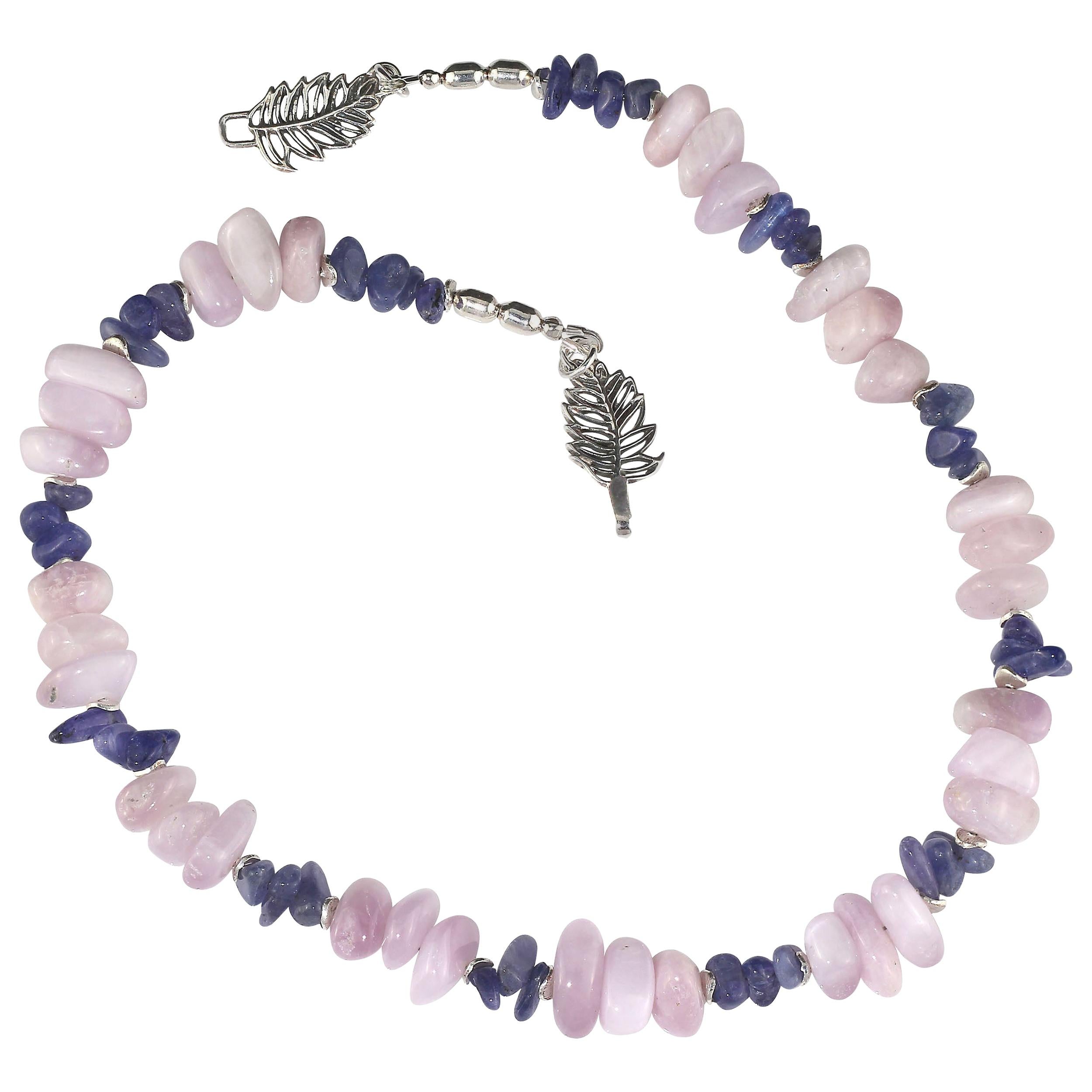 Handmade, unique necklace of glowing Kunzite nuggets and highly polished Tanzanite chips. The pinky-mauve Kunzite plays off the purpley-blue Tanzanite to create a harmoniously elegant necklace. Lovely silver flutters beautifully accent both
