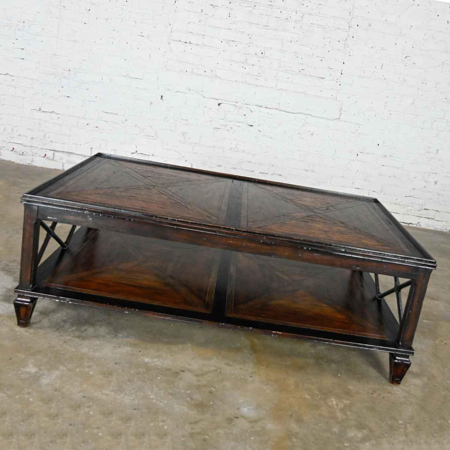 Handsome Theodore Alexander Marst Hill Collection Sumner coffee or cocktail table comprised of mahogany with finished oak and acacia parquetry. Gorgeous condition, keeping in mind that this is vintage and not new so will have signs of use and wear.