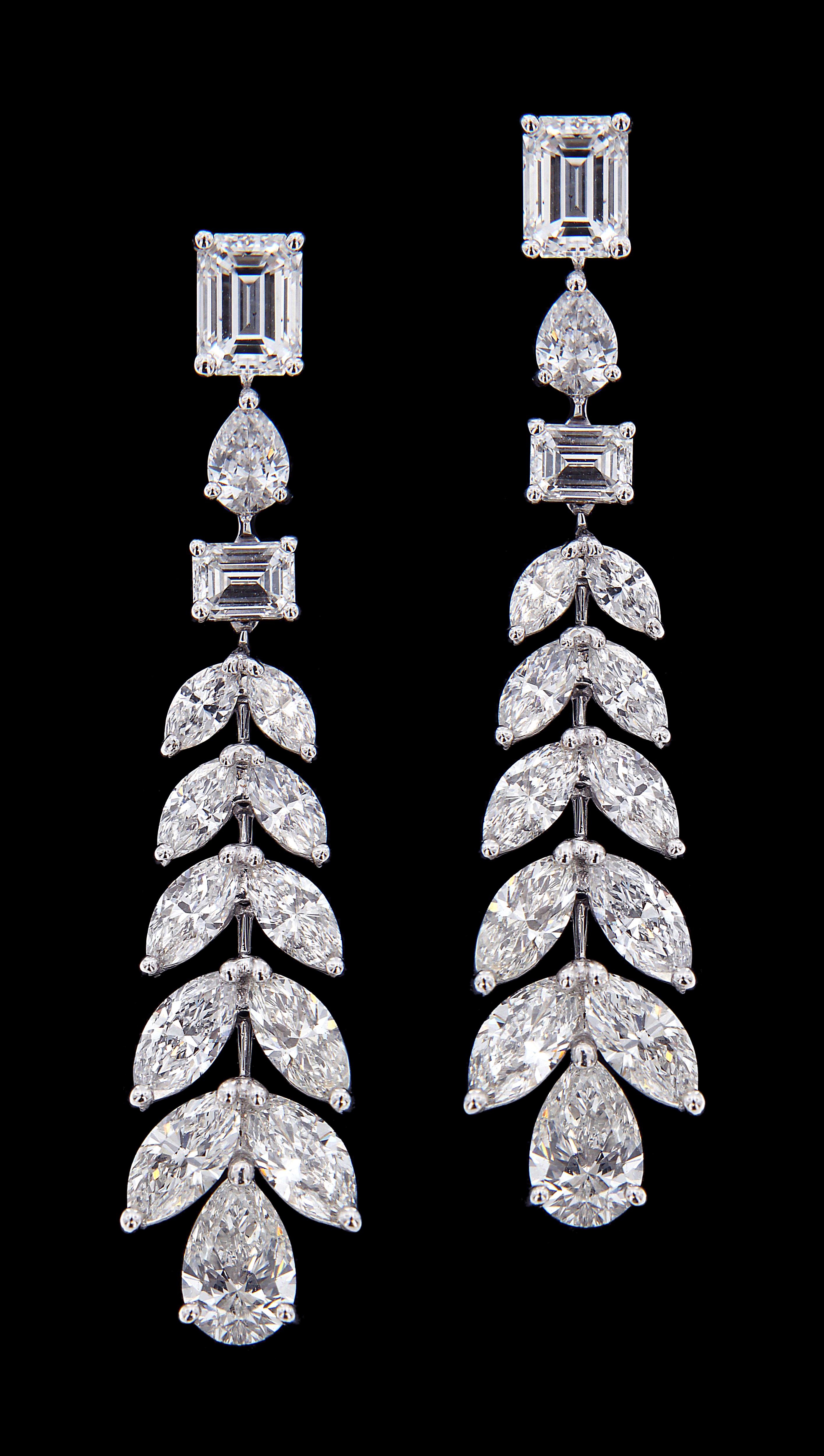 Sumptuous White Gold And Diamond Wedding  Set :
 
Earrings:
Multi shaped Diamonds weighing approximately around 8.153 carats, mounted on 18 karat white gold earring. The earring weighs around 8.669 grams approximately.  


Please note: The prices