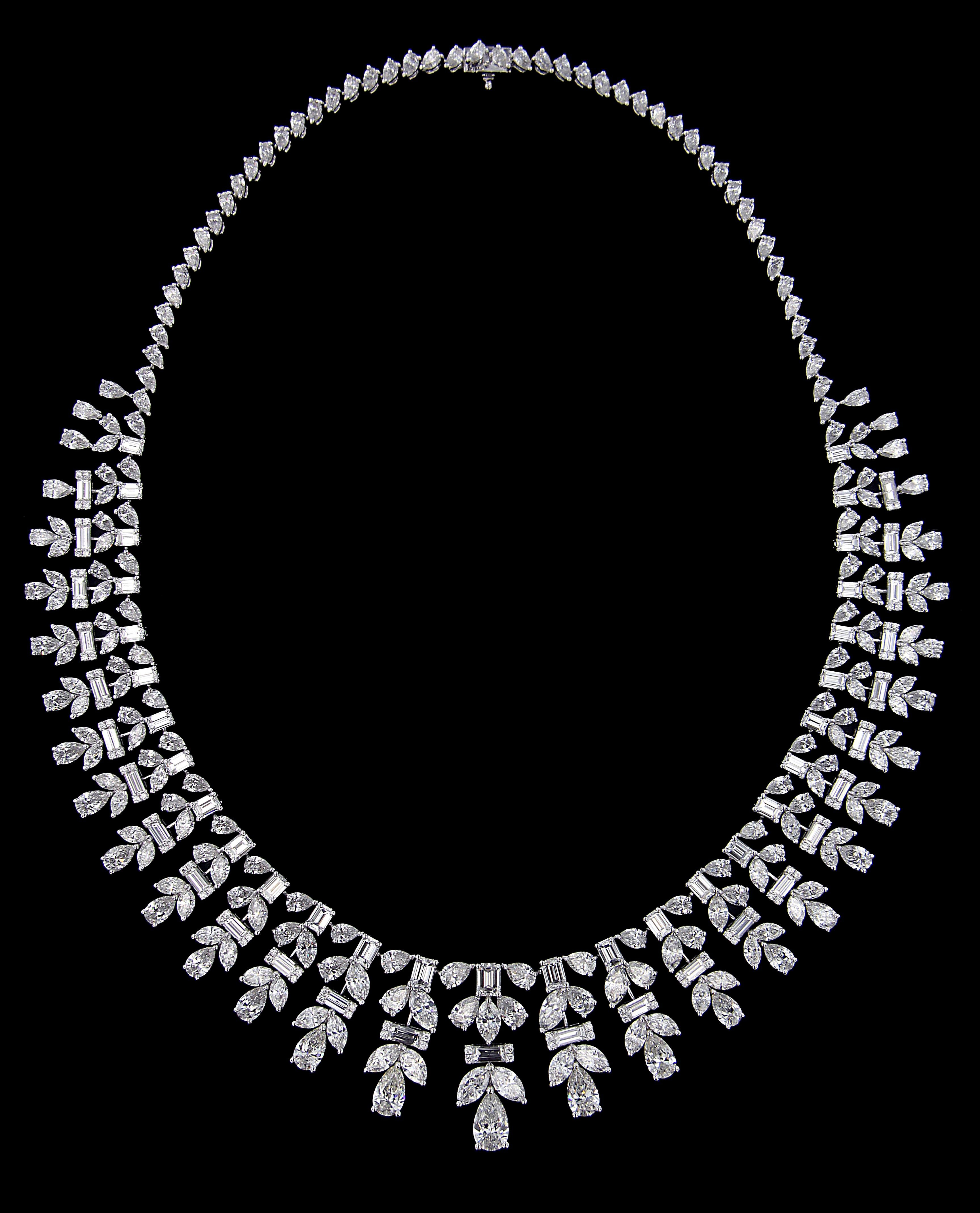 Sumptuous White Gold And Diamond Wedding  Set :
Necklace:
Multi shaped Diamonds weighing approximately around 47.075 carats, mounted on 18 karat white gold necklace. The necklace weighs around 52.475 grams approximately.  
 

Please note: The prices