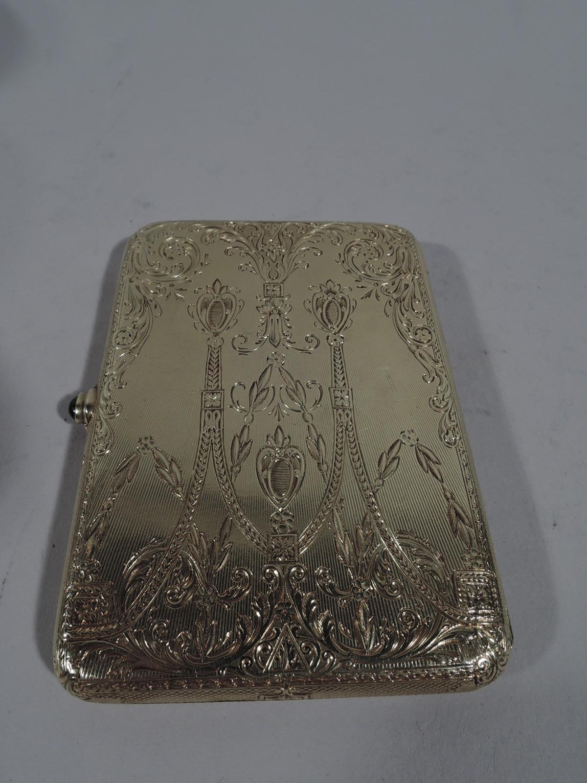 Edwardian 14k yellow gold card case, ca 1910. Rectangular and hinged. On cover are applied swags and leafing scrolls in white gold inset with diamonds and sapphires. On back is engraved same pattern. Very sumptuous and very select. For the exclusive