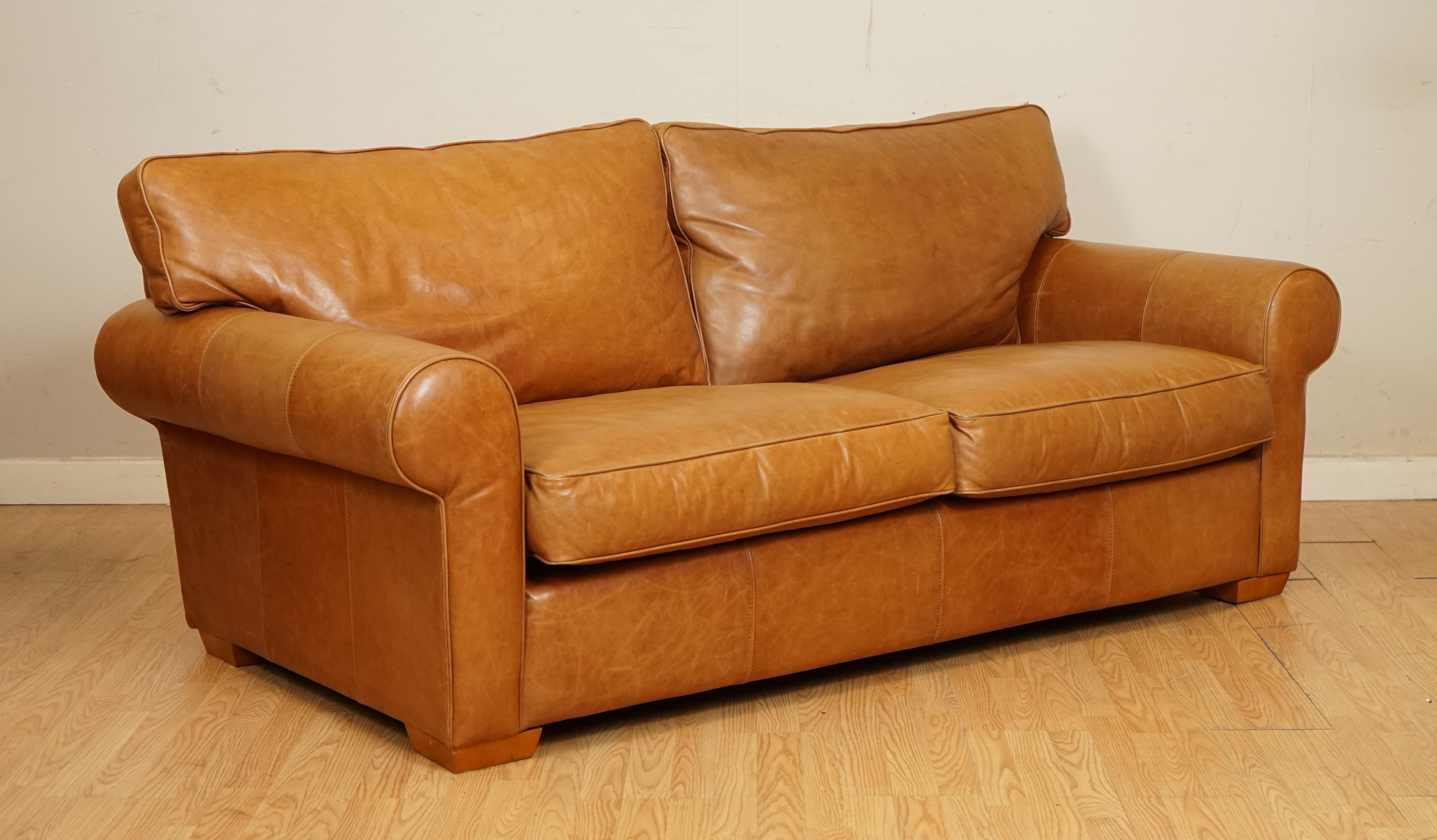 We are so excited to present to you this Tan leather 2 to 3 seater sofa made by Multiyork.

Overall the sofa is in a good condition as you can see from the pictures.

The feel of the leather is amazing and surprisingly soft and smooth.

It has