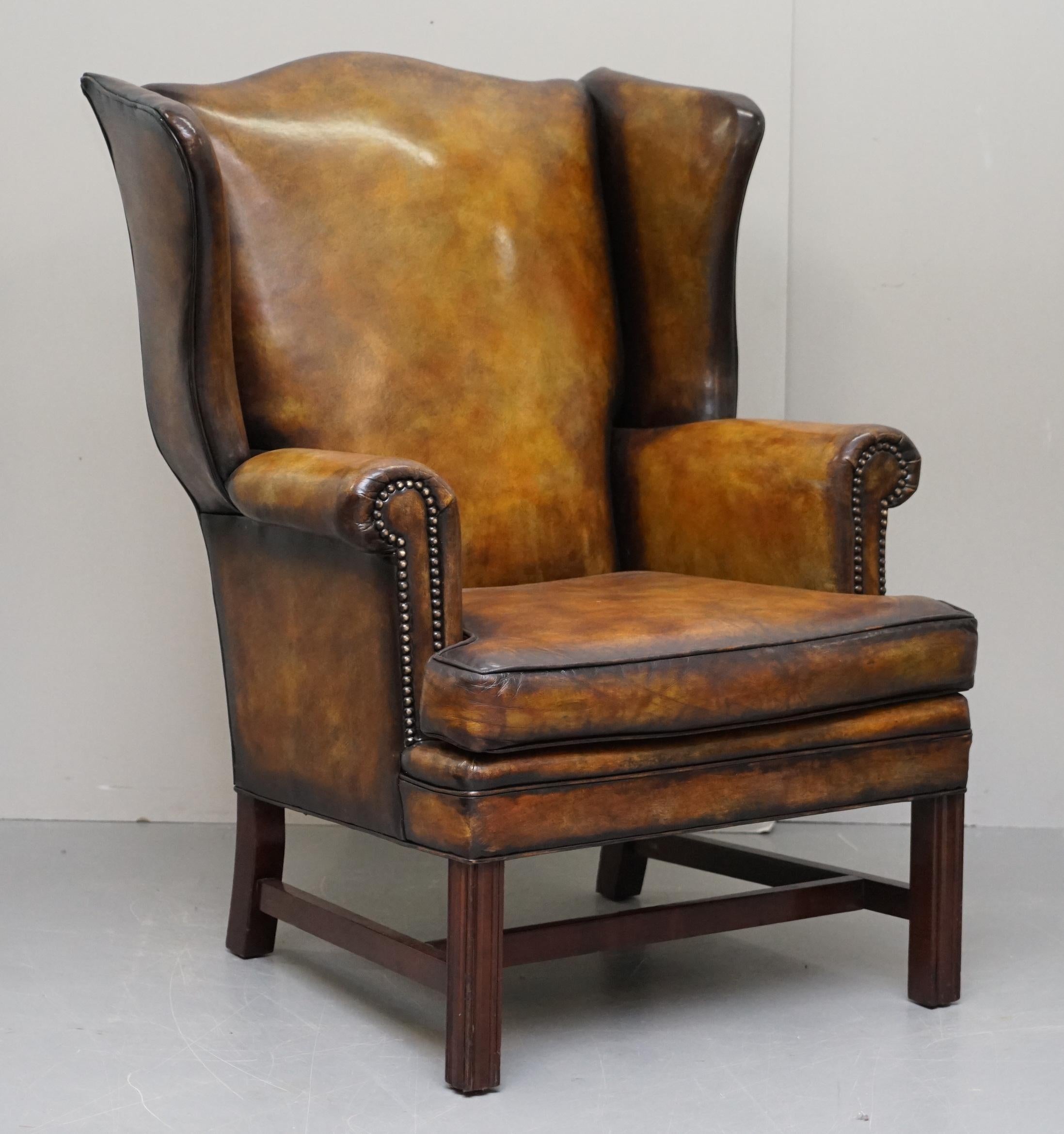 We are delighted to offer for sale this sublime pair of fully restored vintage wingback armchairs in cigar brown leather 

A good looking and comfortable pair of coil sprung vintage wingback armchairs, these are good country house chairs that look