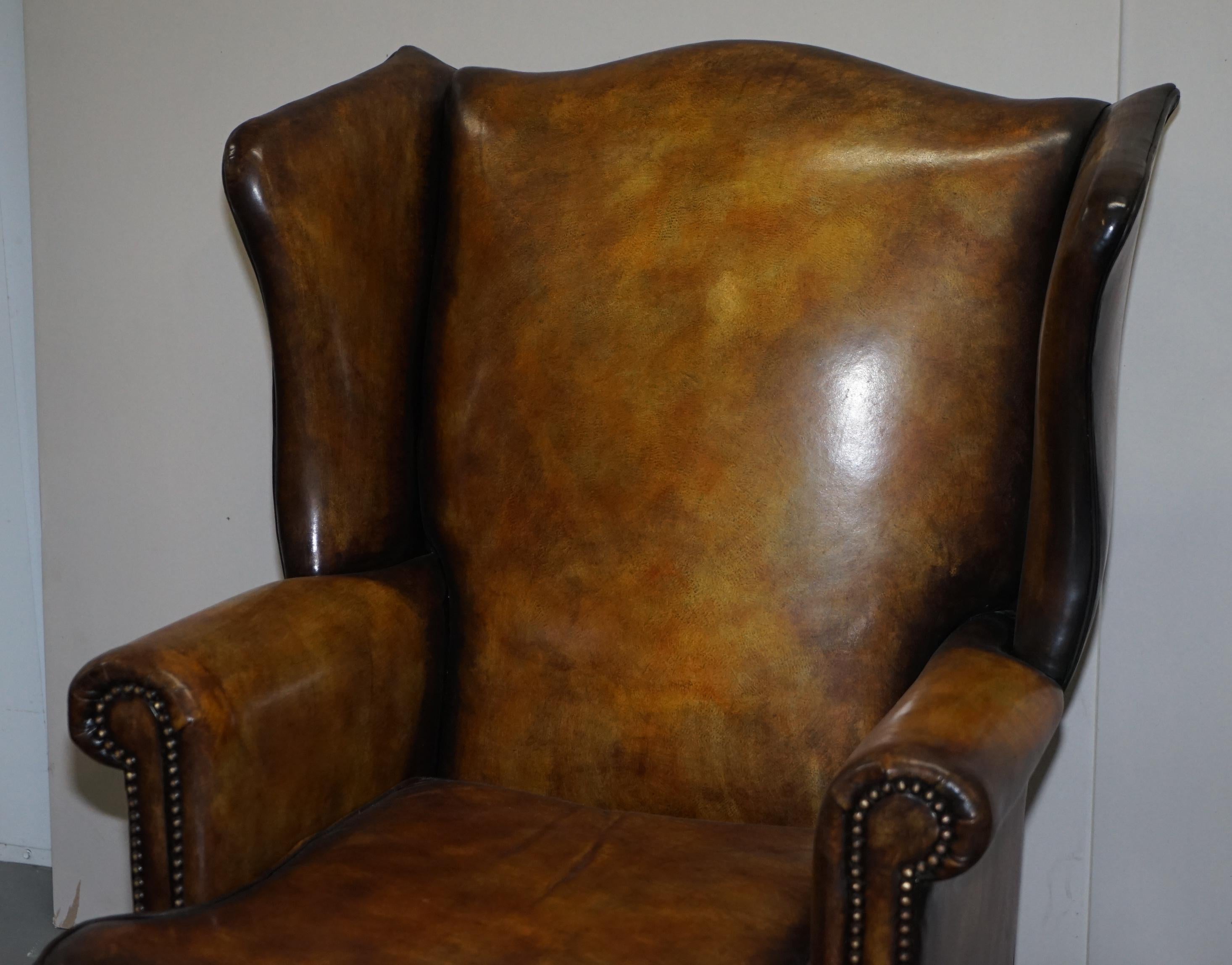 English Sumptuous Pair of Fully Restored Hand Dye Cigar Brown Leather Wingback Armchairs