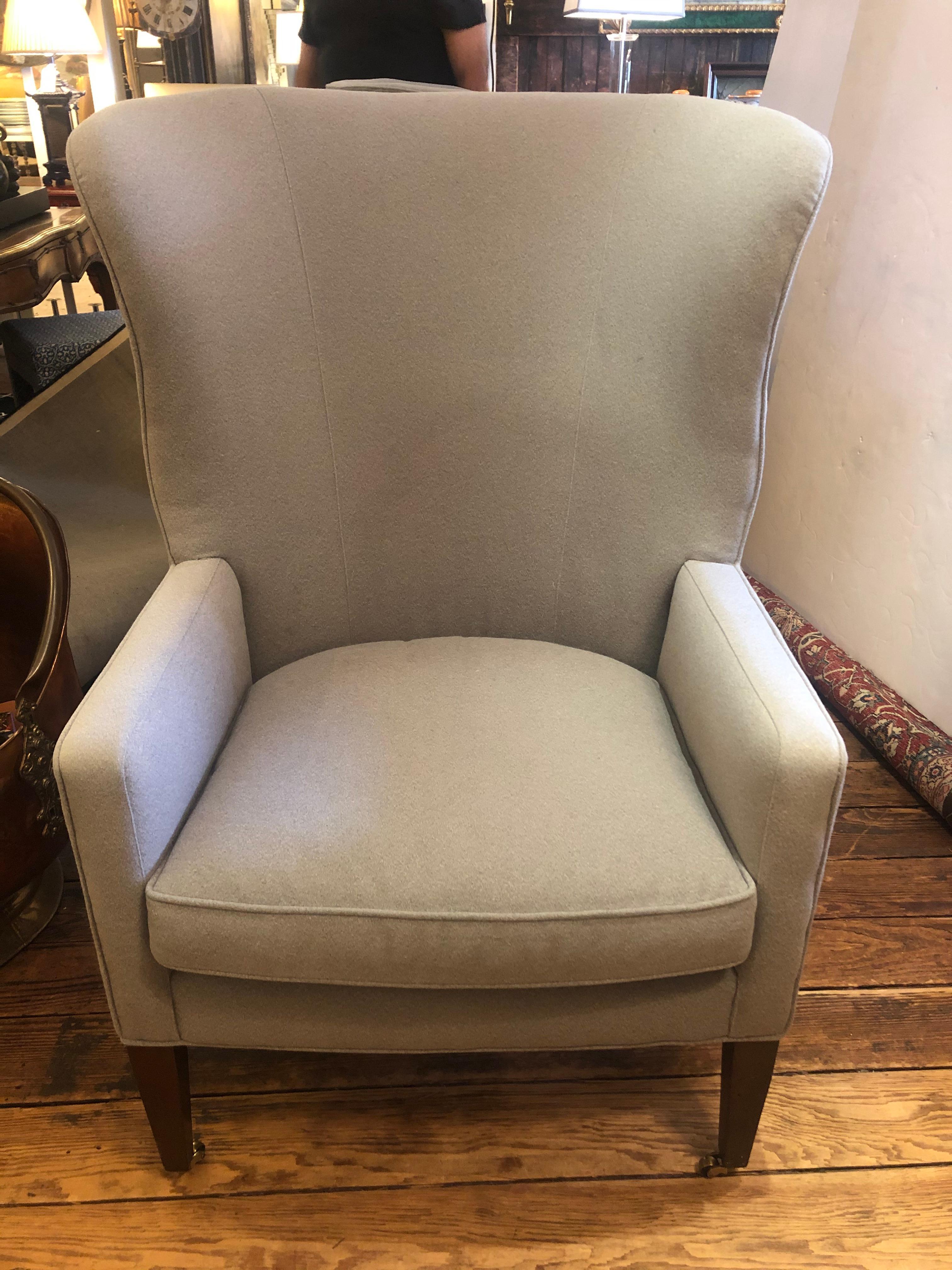 North American Sumptuous Pair of Grey Flannel Upholstered Barrel Back Wing Chairs