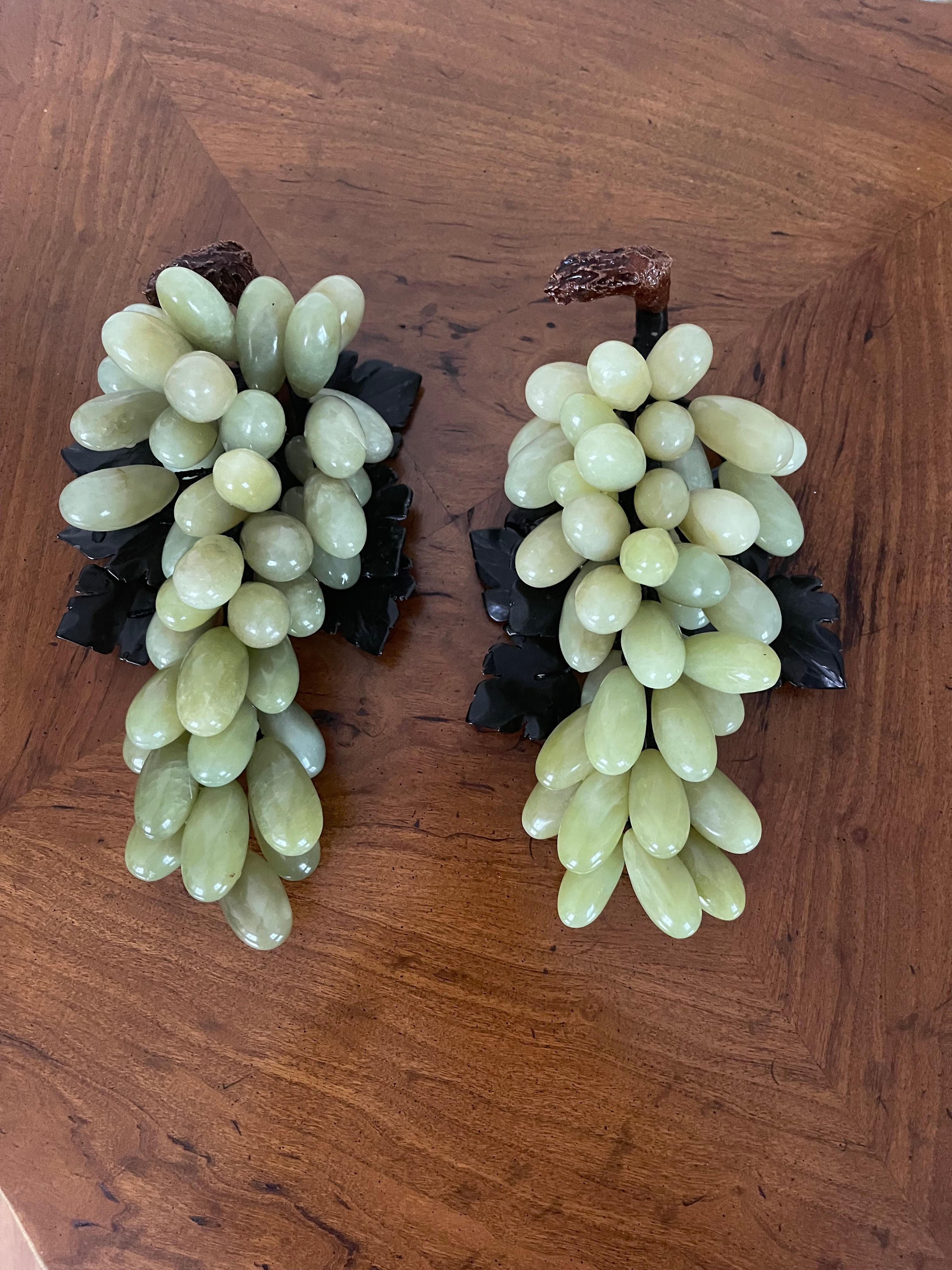 Vintage Chinese Handcarved Jadeite grapes n spinach jade leaves naturalistic organic modern sculptures, a pair. Large and heavy, beautifully made.Believed to bring good fortune and prosperity.