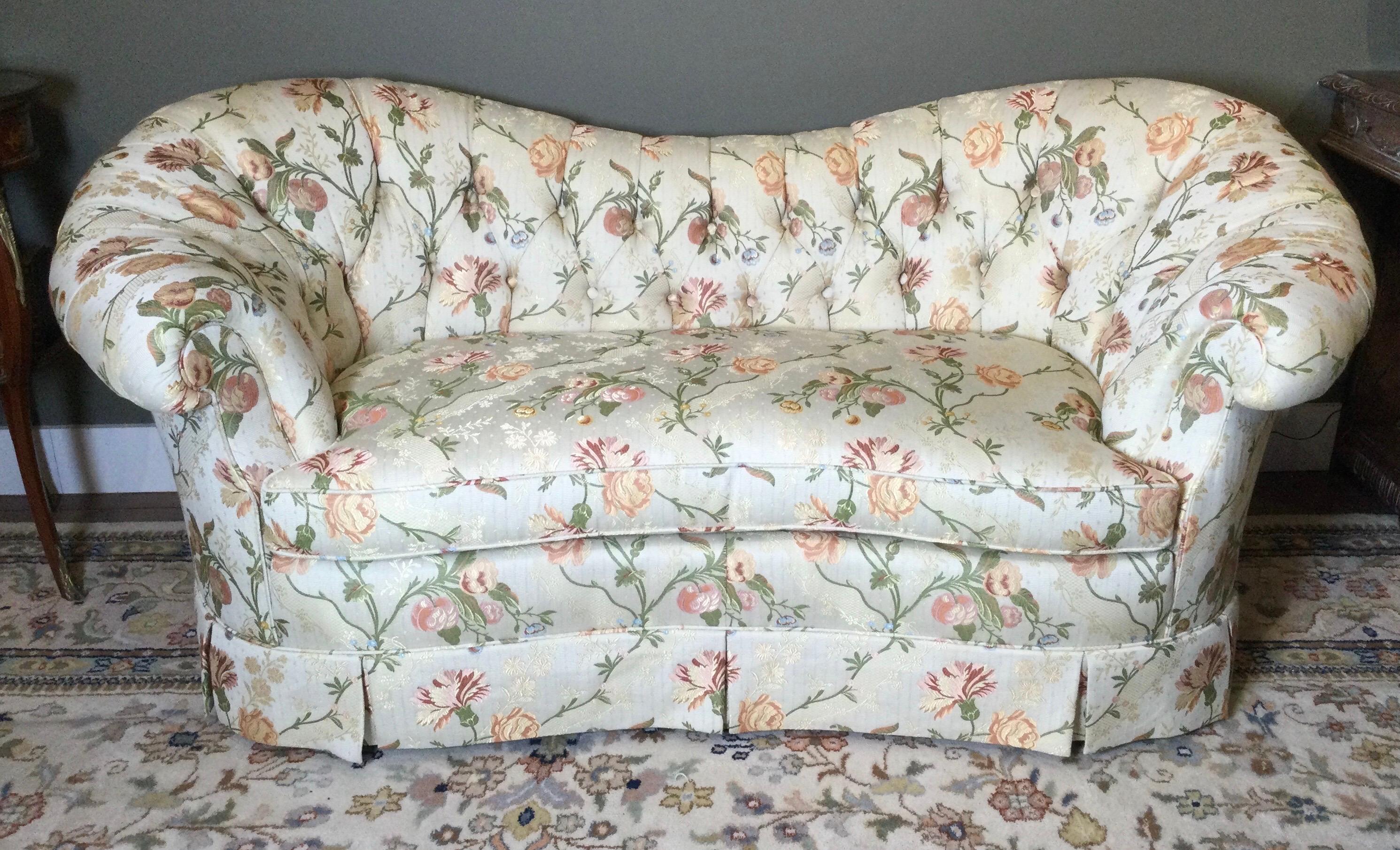 Elegant and formal shapely Baker 70 inch sofa with curved frame with large rolled arms. The fabric is a magnificent woven floral of the highest quality. The kiln dried hardwood frame with 8 way hand ties hourglass coils for the seat which it the