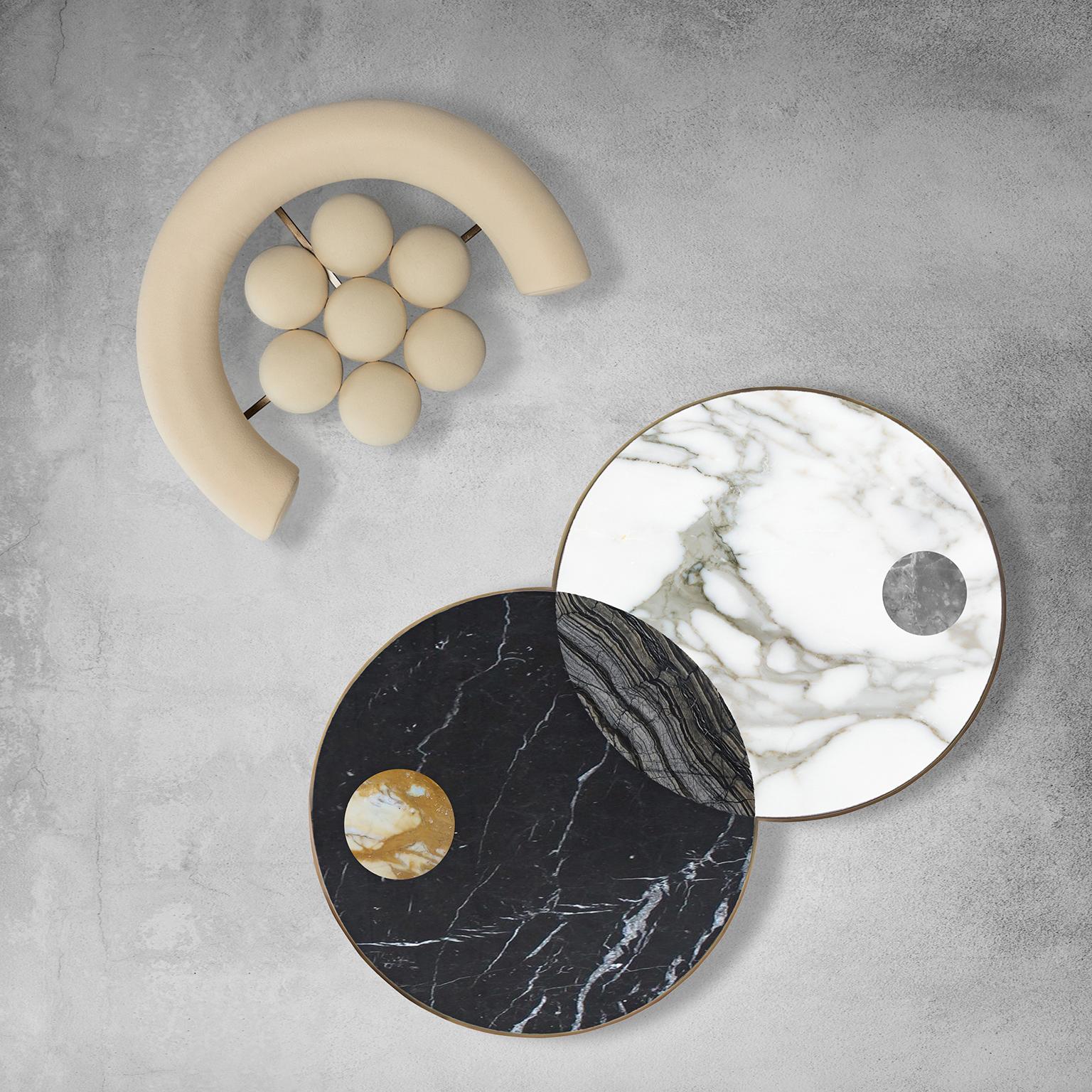 Sun and moon coffee table by Bohinc Studio. From the Lunar collection, this table has discs echoing planetary forms that are bisected and overlaid to create surface patterns and structural elements. These form dynamically-poised bases and marble