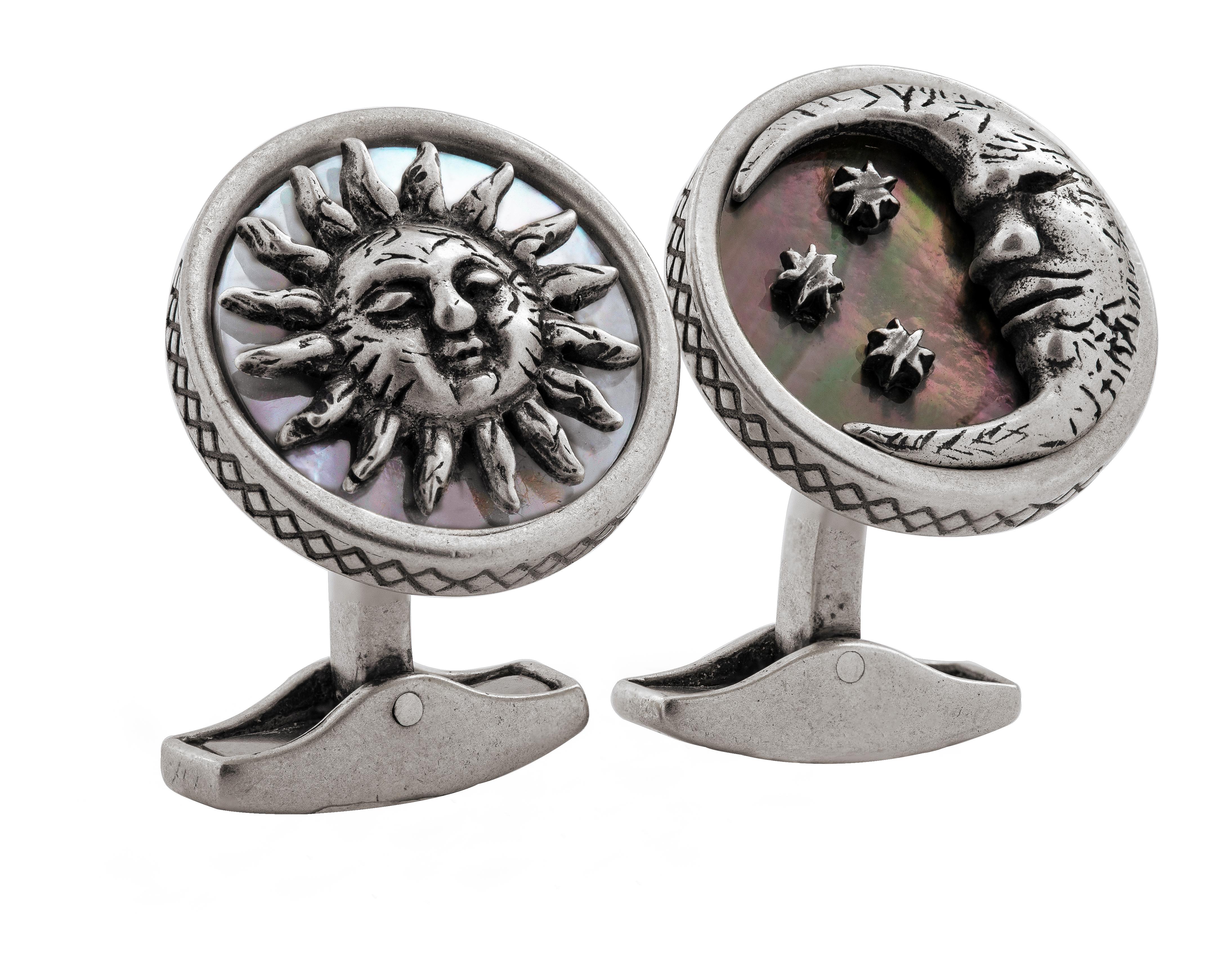 These striking cufflinks are a representation of the waning moon and the rising sun. They are embellished with silver detailing silhouetted on a background of mother of pearl, white for the bright day and black for the mysterious night. Express your