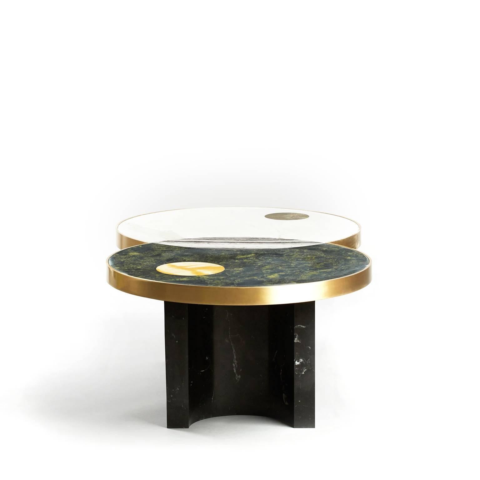 The lunar collection introduces the half moon dining table, the sun and moon coffee table and the full moon side table. Discs echoing planetary forms are bisected or overlaid to create surface patterns and structural elements, forming