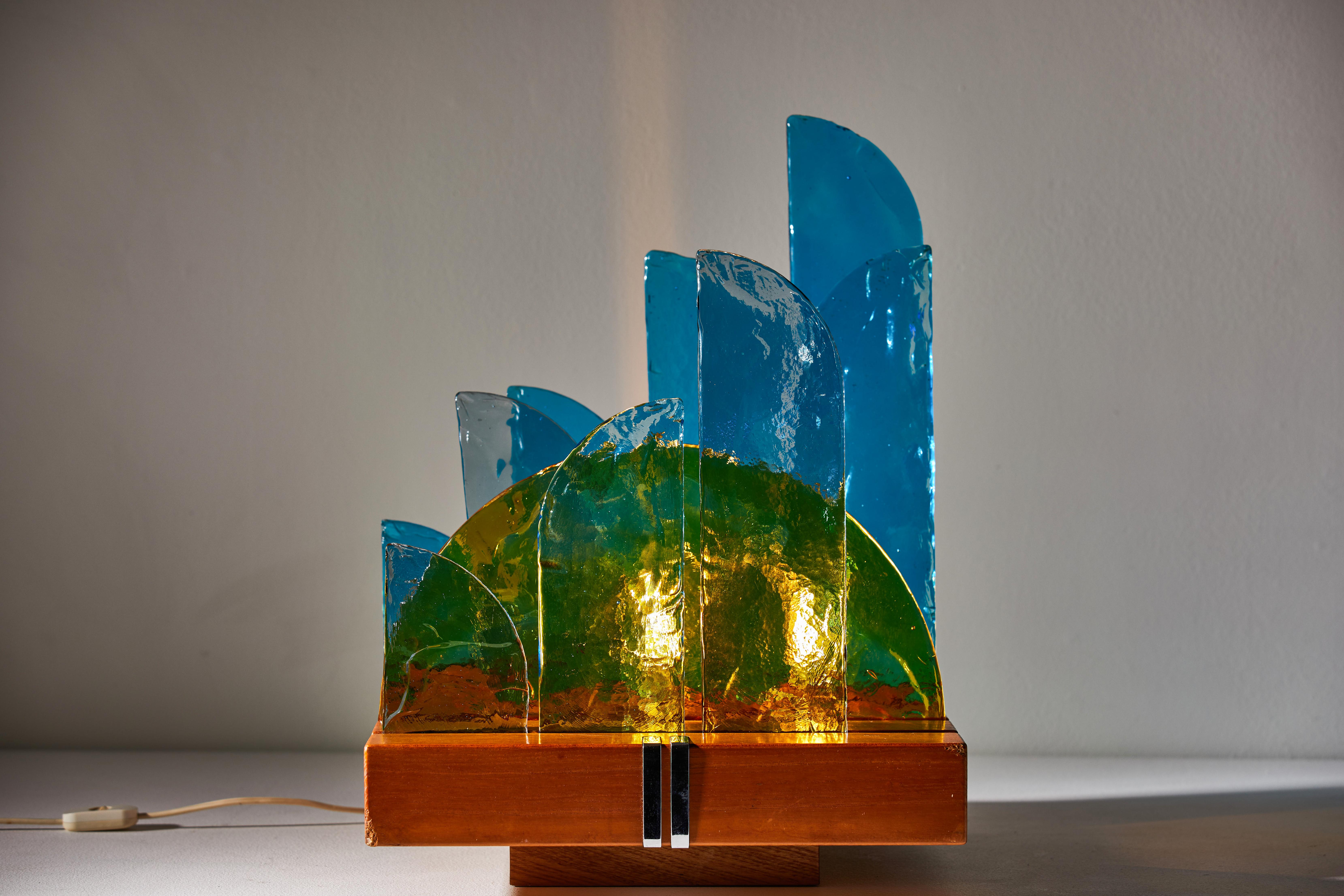 Rare and important Il Sole and la Fuvola which translates to Sun and the cloud table lamp by Luigi Massoni for Itter Elettronica. Designed and manufactured in Italy, 1970. Colored glass, wood, chromed metal inlay. Original cord. Takes two E14