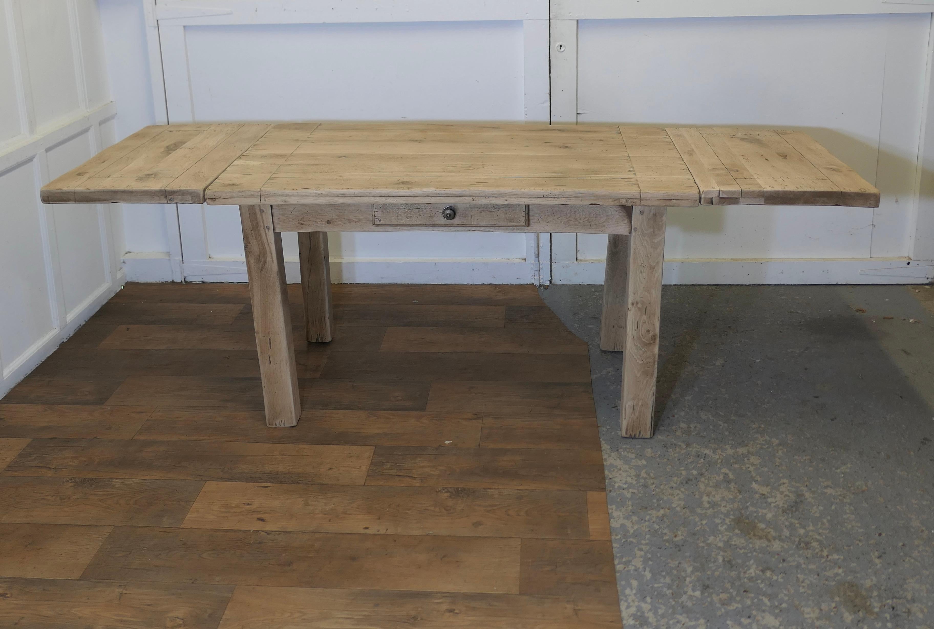 Sun Bleached Oak 7ft Extending Dining Table

The table has a very heavy solid top and it is extended by adding a pair of leaves, one at each end 
The Table is heavy quality thick oak which has been bleached giving it a great look
The table is in